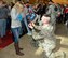 Staff Sgt. Justin Padley, fire team member for the Wis. Air National Guard's 115th Fighter Wing Security Forces Squadron proposes to his soon-to-be fiancée Wendy Anderson upon returning to Dane County Regional Airport  Mar. 2. Twenty six members of the Wing's Security Forces Squadron spent six months deployed in support of Operation Enduring Freedom/Combined Joint Task Force-Horn of Africa and secured 3,500 personnel and $7.2 billion worth of assets within their area of responsibility. (Air National Guard photo by Master Sgt. Paul Gorman)