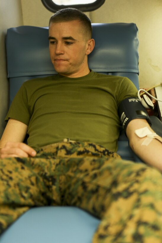 Lance Cpl. Ryan S. Sullivan of Loveland Colo., and a field wireman with 2nd Tank Battalion, 2nd Marine Division, relaxes as blood is being drawn for the Armed Services Blood Program’s blood drive at the tank ramps aboard Marine Corps Base Camp Lejeune, Feb. 21, 2014. Sullivan said this was his first time donating blood and that it wouldn’t be the last. The blood drive was held to support wounded, ill, or injured Marines and sailors in need of a blood transfusion. “I was nervous at first but once the process started I began to relax,” said Sullivan.