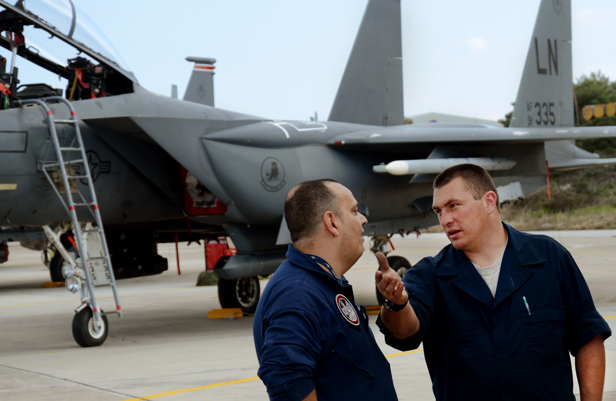 Hellenic air force Chief Master Sgt. Siogkas Christos, aircrew life support, receives an F-15E Strike Eagle orientation tour from Staff Sgt. Trevor Wabel, 494th Expeditionary Fighter Squadron crew chief, at Souda Air Base, Greece, during a flying training deployment, Feb. 27, 2014. Military relations between the U.S. and Greece date back to the early 19th century, when Greece was fighting for independence, as the two nations found commonality under their values of freedom and democracy. (U.S. Air Force photo by Staff Sgt. Thomas Trower/Released)