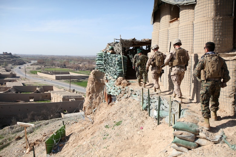 Marines with Security Force Assistance Advisor Team 2-215 and soldiers with 2nd Brigade, 215th Corps, Afghan National Army visit an outpost near Forward Operating Base Robinson, Feb. 24, 2014. Colonel AbdulHai Neshat, the executive officer of 2nd Brigade, invited Col. Christopher Douglas, the team leader of SFAAT 2-215, to visit the outposts and see the progress that was made in a recent operation, Oqab 144.