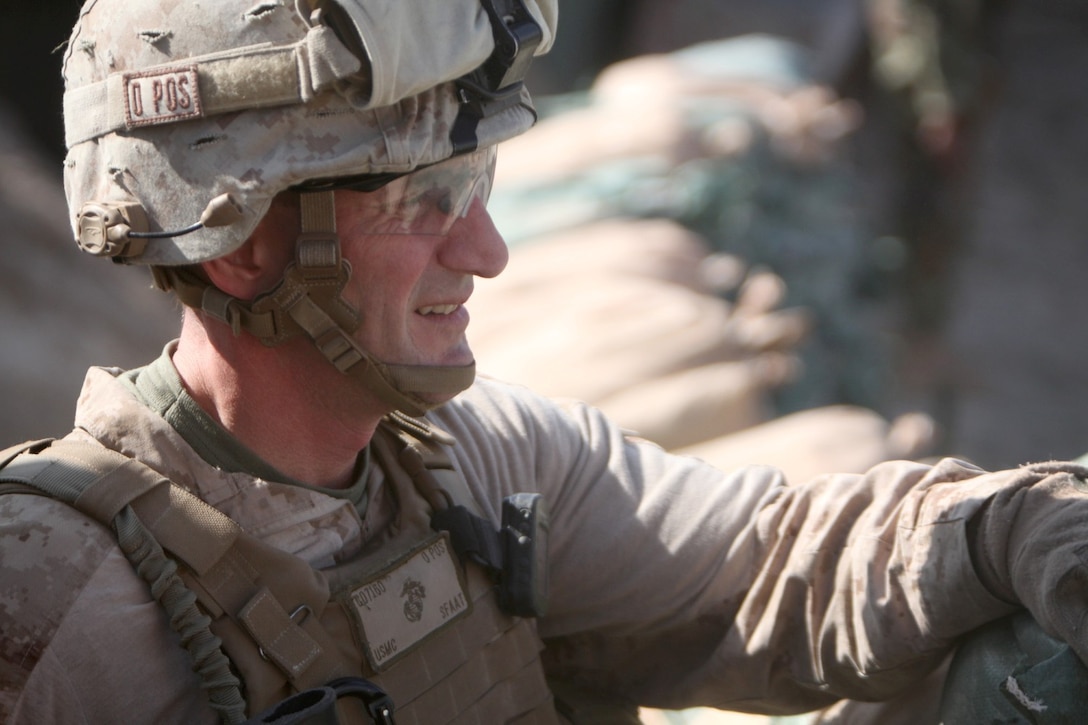 Colonel Christopher Douglas, the team leader of Security Force Assistance Advisor Team 2-215, looks out over the Sangin Valley from an outpost located near Forward Operating Base Robinson, Helmand province, Afghanistan, Feb. 24, 2014. Douglas, a reservist from Ballston Spa, N.Y., expressed his confidence in the ability of the 2nd Brigade, 215th Corps, Afghan National Army, to effectively provide security to the citizens of the region during the upcoming Afghan presidential elections.