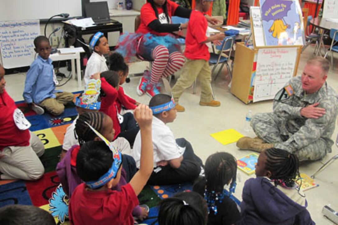 Huntsville Center Commander, Col. Robert Ruch reads to Highlands Elementary School students March 3.                            