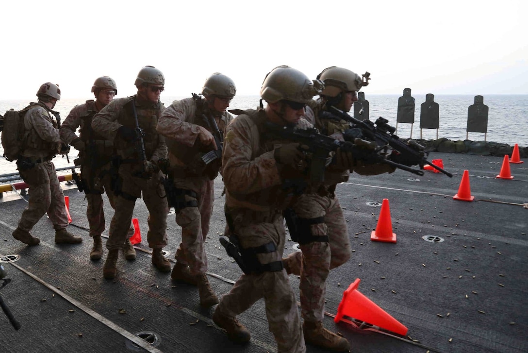 ARABIAN SEA (March 1, 2014) – U.S. Marines assigned to Reconnaissance Platoon, Battalion Landing Team 1/4, 13th Marine Expeditionary Unit (MEU), conduct live fire drill aboard USS Boxer (LHD 4), March 1, 2014. The 13th MEU is deployed with the Boxer Amphibious Ready Group as a theater reserve and crisis response force throughout the U.S. 5th Fleet area of responsibility. (U.S. Marine Corps photo by Gunnery Sgt. Ajiboye Magbagbeola, 13th Marine Expeditionary Unit Combat Camera/Released)
