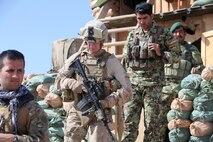 Marines with Security Force Assistance Advisor Team 2-215 and soldiers with 2nd Brigade, 215th Corps, Afghan National Army visit an outpost near Forward Operating Base Robinson, Feb. 24, 2014. The outposts overlook the Sangin Valley and Route 611 and are vital to mission success in the region.