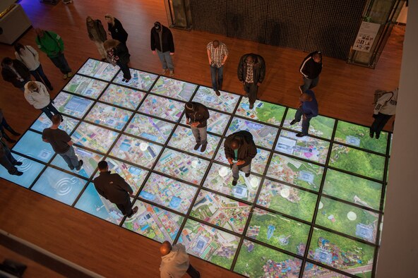 Airmen view a visual display of Gunsan during a tour of the city at Gunsan, Republic of Korea, Feb. 21, 2014. The Airmen participated in the Gunsan Industrial Tour, one of several offered by the 8th Fighter Wing Public Affairs community relations office.  The tour provided Airmen insight to Gunsan’s history, current events and future plans. (U.S. Air Force photo by Senior Airman Armando A. Schwier-Morales/Released)