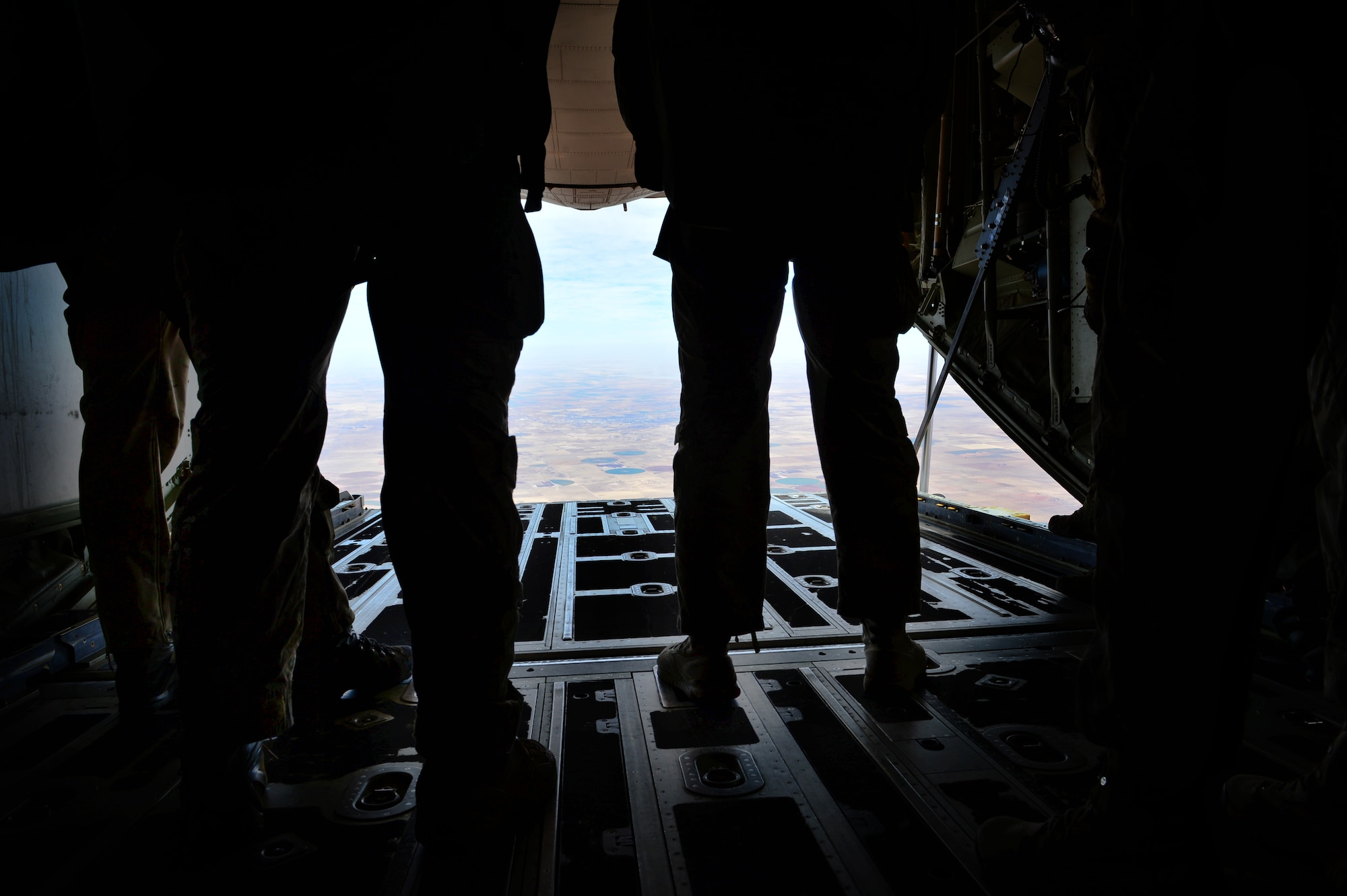 Members from the 26th Special Tactics Squadron stand aboard an MC-130J Commando II before completing a Military Free Fall jump Feb. 28, 2014 at Melrose Air Force Range, N.M. Two members of the 26th Special Tactics Squadron, joined by two other special tactics members, conducted the first Military Free Fall jump in conjunction with one of the many aerial assets maintained at Cannon. (U.S. Air Force photo/ Senior Airman Eboni Reece)