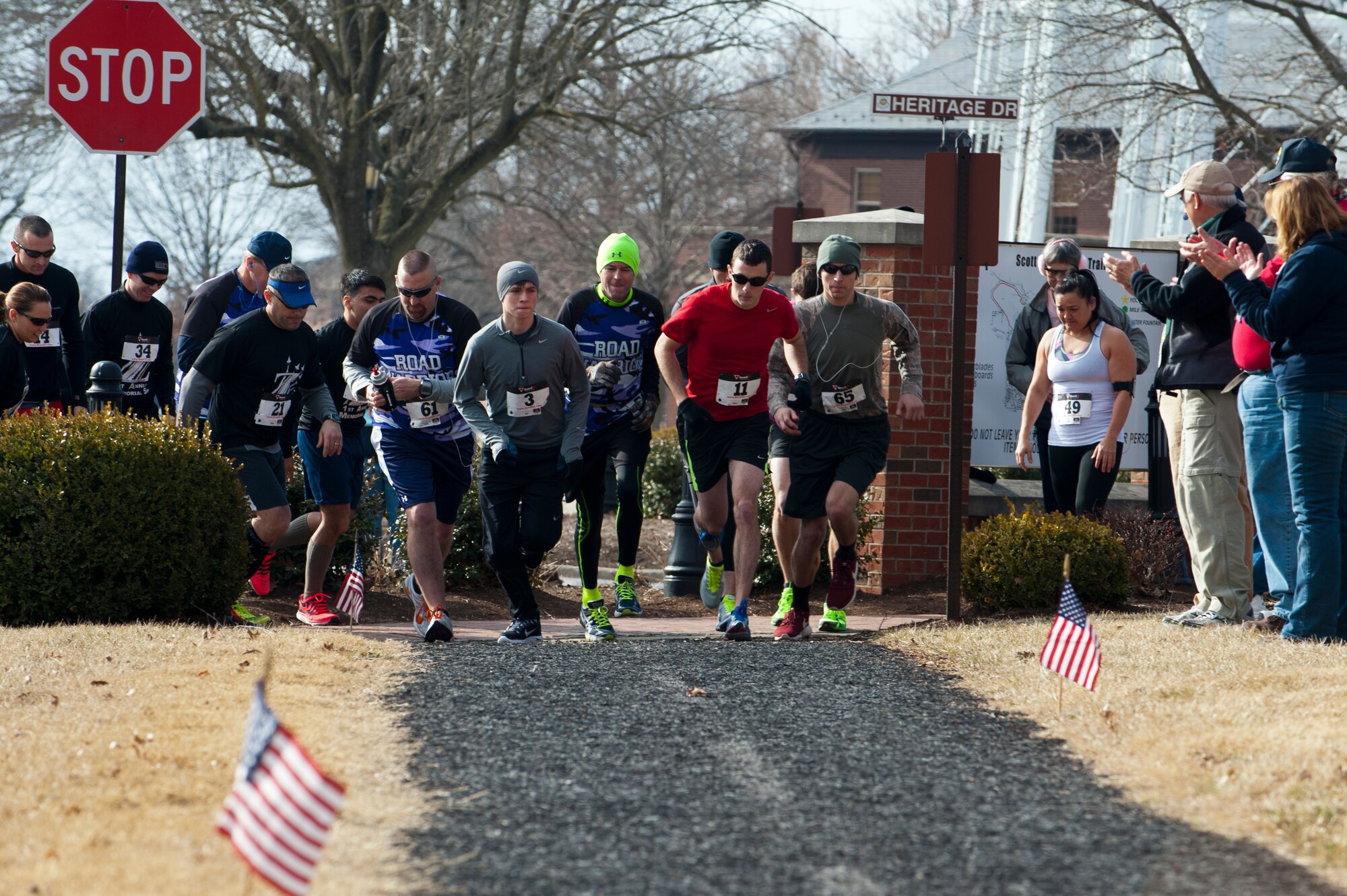 Runners begin the Airman 1st Class Zachary Cuddeback 5k Memorial Run March 1 at Scott Air Force Base. The run honored Cuddeback, who was killed by a gunman in 2011 while stationed at Ramstein Air Base, Germany. Cuddeback called O'Fallon, Ill., home. (U.S. Air Force photo/Airman 1st Class Kiana Brothers).
