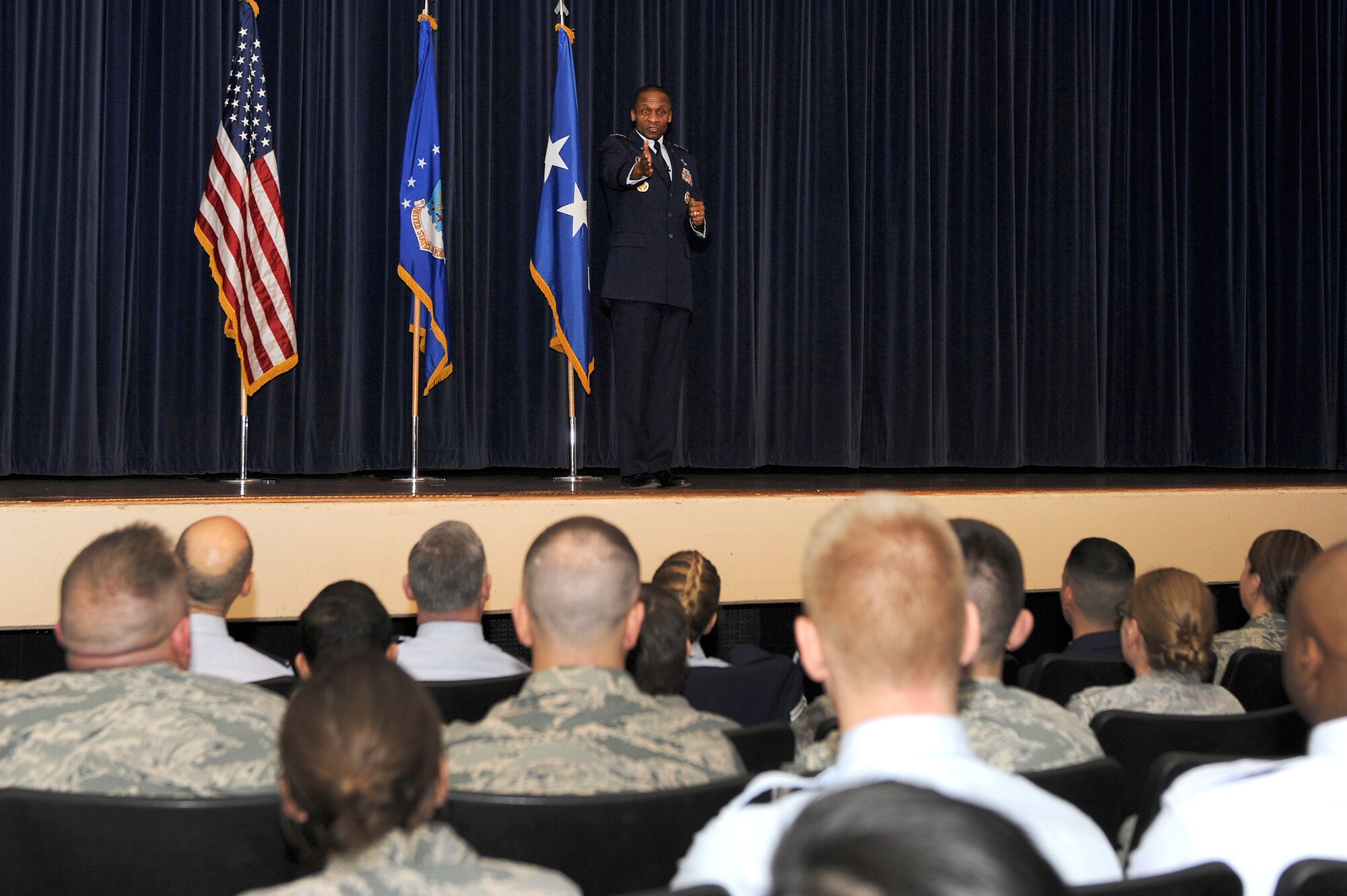 Lt. Gen. Darren W. McDew, 18th Air Force commander, speaks to 375th Air Mobility Wing Airmen during an “all call” here Feb. 28, 2014 at Scott Air Force Base, Ill. McDew spoke on a variety of subjects, including force management, budget cuts and upcoming changes to the Air Force.  (U.S. Air Force photo/Senior Airman Divine Cox)