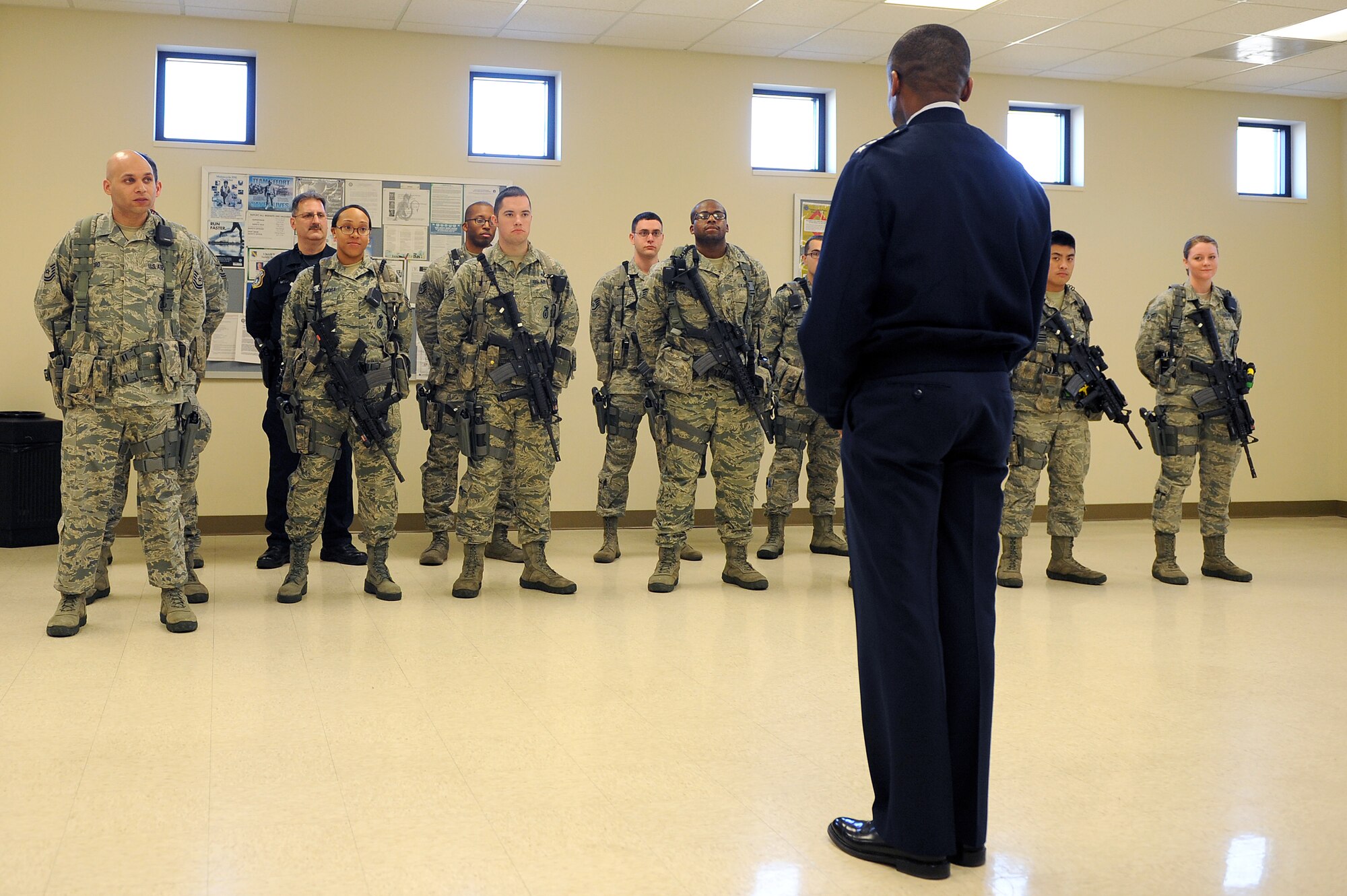 Lt. Gen. Darren W. McDew, 18th Air Force commander, speaks to members of the 375th Security Force Squadron during an official visit here, Feb. 28, 2014 at Scott Air Force Base, Ill. McDew visited numerous organizations around the base to discuss the wing mission and how it enables America’s rapid global mobility. (U.S. Air Force photo/Senior Airman Divine Cox)