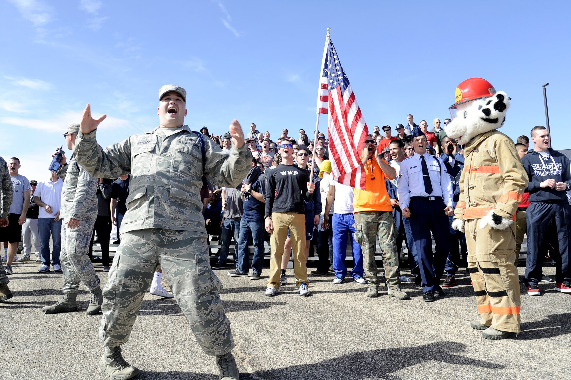 GOODFELLOW AIR FORCE BASE, Texas -- Tech. Sgt. Eric Hurtado, 312th Training Squadron military training leader, shows his team spirit with other members of the 312th TRS during the 17th Training Group’s first quarter drill competition here Feb. 22. The 312th TRS competed against the 315th Training Squadron and the 316th Training Squadron, ultimately winning the Spirit Award. (U.S. Air Force photo/ Staff Sgt. Austin Knox)