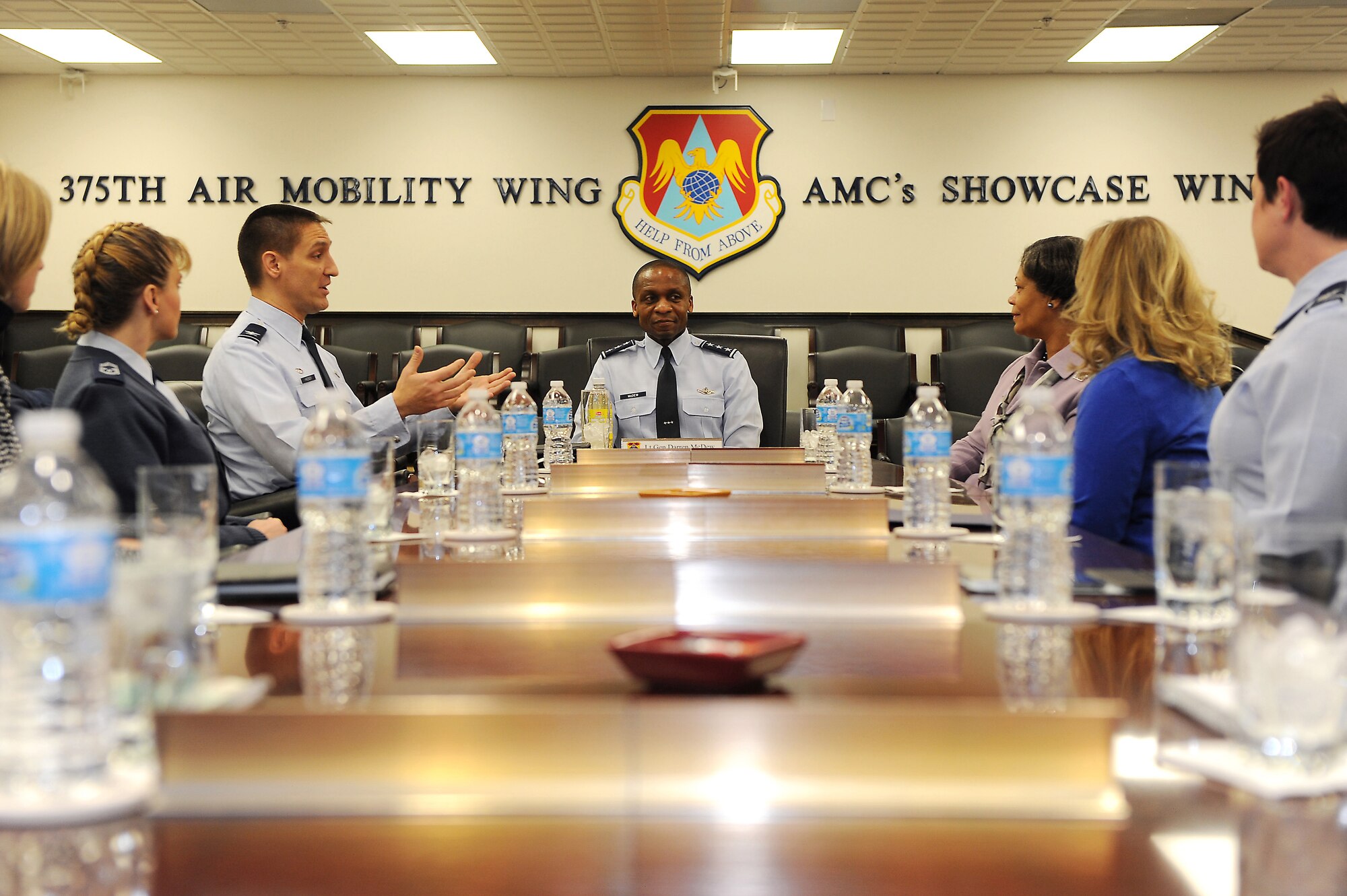 18th Air Force commander Lt. Gen. Darren W. McDew receives a briefing from Col. Kyle Kremer, 375th Air Mobility Wing commander, during an official visit here Feb. 28, 2014 at Scott Air Force Base, Ill.  Kremer briefed McDew on the wing's priorities and how its Airmen accomplish the mission.  (U.S. Air Force photo/Senior Airman Divine Cox)