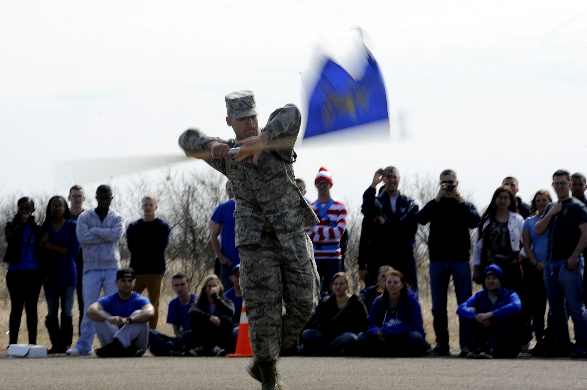 GOODFELLOW AIR FORCE BASE, Texas -- Airman Zackary Sicard, 315th Training Squadron drill team member, twirls the guidon during the exhibition drill portion of the 17th Training Group’s first quarter drill competition here Feb. 22. The judges scored each squadron on five events: individual drill, exhibition drill, regulation drill, open ranks and spirit. The 315th TRS won open ranks, regulation and exhibition drills as well as the Overall Award. (U.S. Air Force photo/ Staff Sgt. Austin Knox)