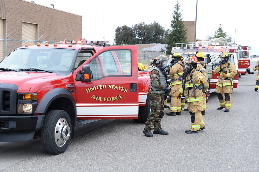 Members of the 144th Civil Engineer Squadron’s Fire Department respond to a simulated chemical spill during Operation Dessert Eagle 2014, a Homeland Defense Operational Readiness Exercise at the 144th Fighter Wing March 1, 2014. The exercise is the first for the wing implementing the new Air Force Inspection System and involved several scenarios testing the installation’s ability to survive and operate during incidents and attacks at home station. (Air National Guard photo by Senior Master Sgt. Chris Drudge)