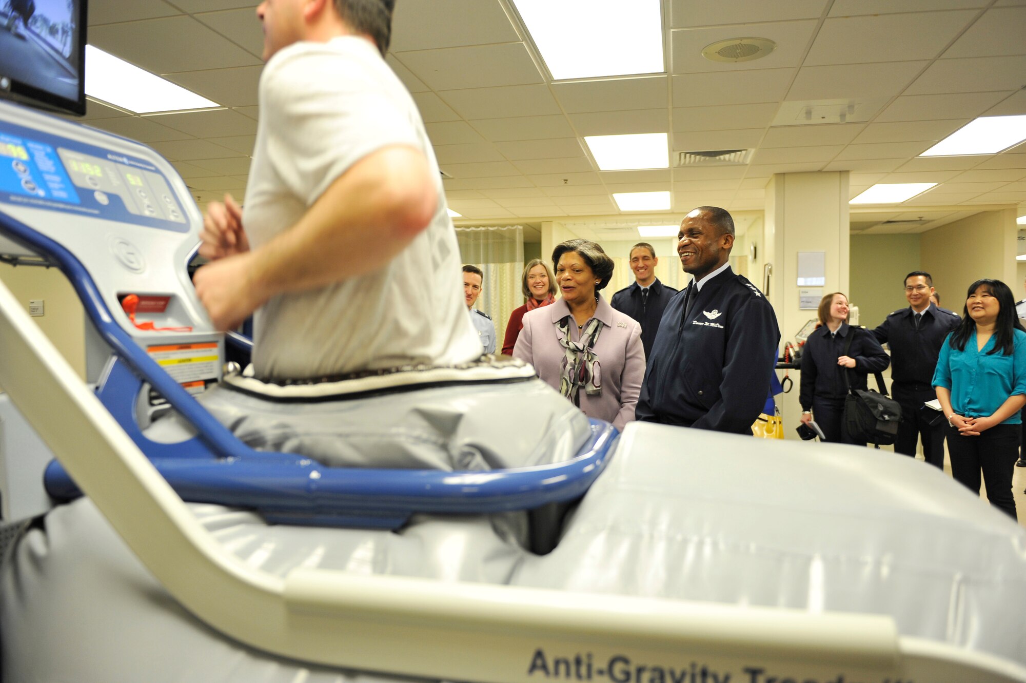 Lt. Gen. Darren W. McDew, 18th Air Force commander, and his wife Evelyn, visit the 375th Medical Group physical therapy clinic during an official visit here Feb. 28, 2014 at Scott Air Force Base, Ill. McDew was briefed on how the 375th Medical Group helps the Airmen of Team Scott stay fit, healthy and ready to accomplish the mission. (U.S. Air Force photo/Airman 1st Class Kiana Brothers)