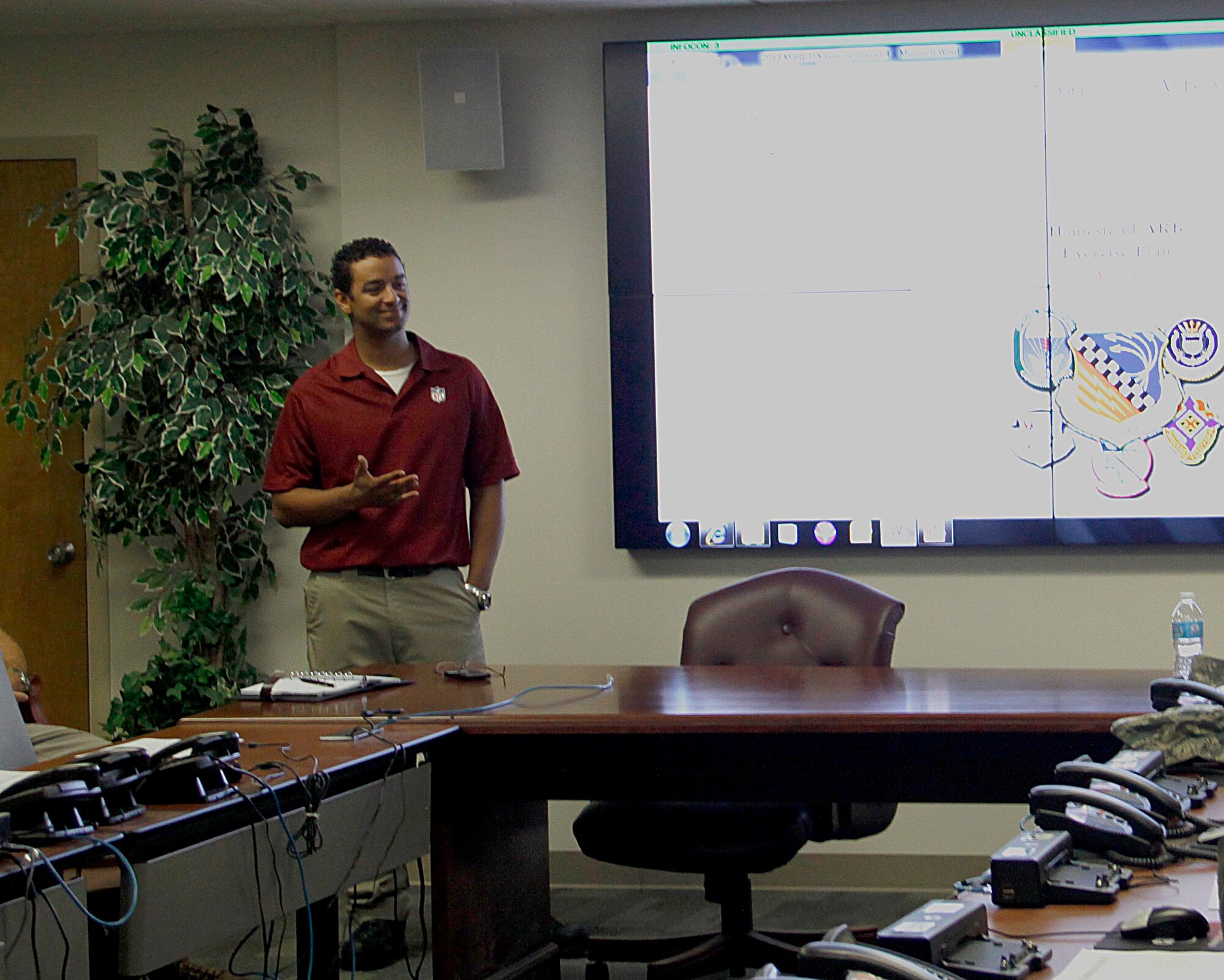 Jason Sundin, 482nd Fighter Wing chief of emergency management, briefs various Wing Inspection Team members during a table top discussion of an upcoming exercise as part of the new Air Force Inspection System at Homestead Air Reserve Base, Fla., Feb. 27. The new Air Force Inspection System process began here in August 2013 and will culminate in a Capstone Event this summer. (U.S. Air Force photo by/Senior Airman Jaimi L. Upthegrove)
