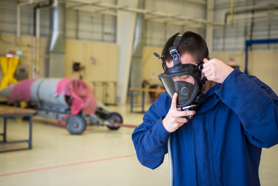 U.S. Air Force Senior Airman Theodore Ross, 23d Component Maintenance Squadron fuel systems maintenance journeyman, checks environmental conditions within a C-130 fuselage tank using a photo ionization detector at Moody Air Force Base, Ga., Mar. 4, 2014. Ross participated in a confined space casualty extraction exercise, meant to simulate rescuing an unconscious or incapacitated Airman from a fuselage tank. (U.S. Air Force photo by Airman 1st Class Ryan Callaghan/Released)

