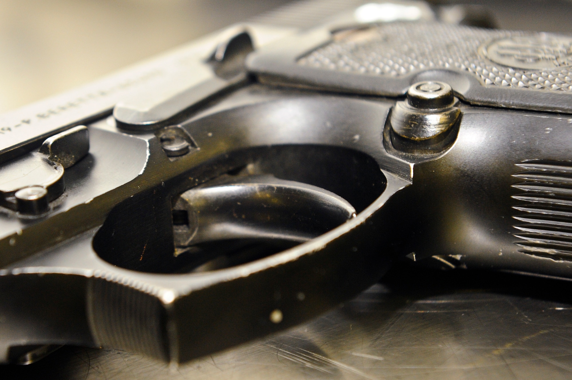 An M-9 pistol rests on a table at the 1st Special Operations Security Forces Squadron combat arms section on Hurlburt Field, Fla., March 3, 2014. Tech. Sgt. Johnny Ellison, 1st SOSFS combat arms NCO in charge, inspected the pistol to ensure it’s in serviceable condition. (U.S. Air Force photo/Senior Airman Michelle Patten) 