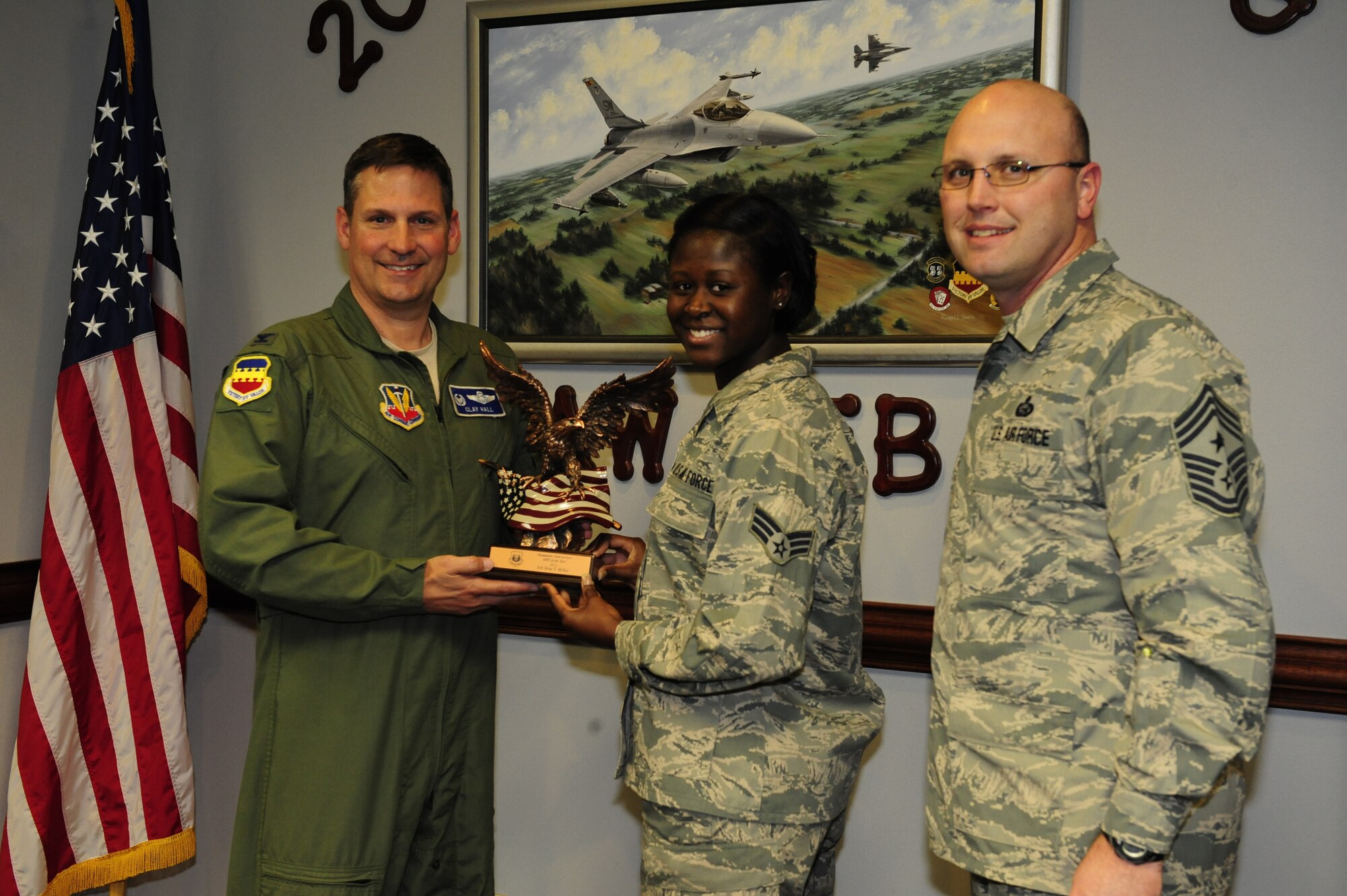 U.S Air Force Senior Airmen Tewa McKay, 20th Operations Group airfield management operations shift lead, receives the Airman of the Year award from Ninth Air Force on Shaw Air Force Base, S.C., March 3, 2014. Every year annual award winners are chosen who have performed exceptionally at their job, within the community and have shown a passion for improving themselves. (U.S. Air Force photo by Airman 1st Class Diana M. Cossaboom/Released)