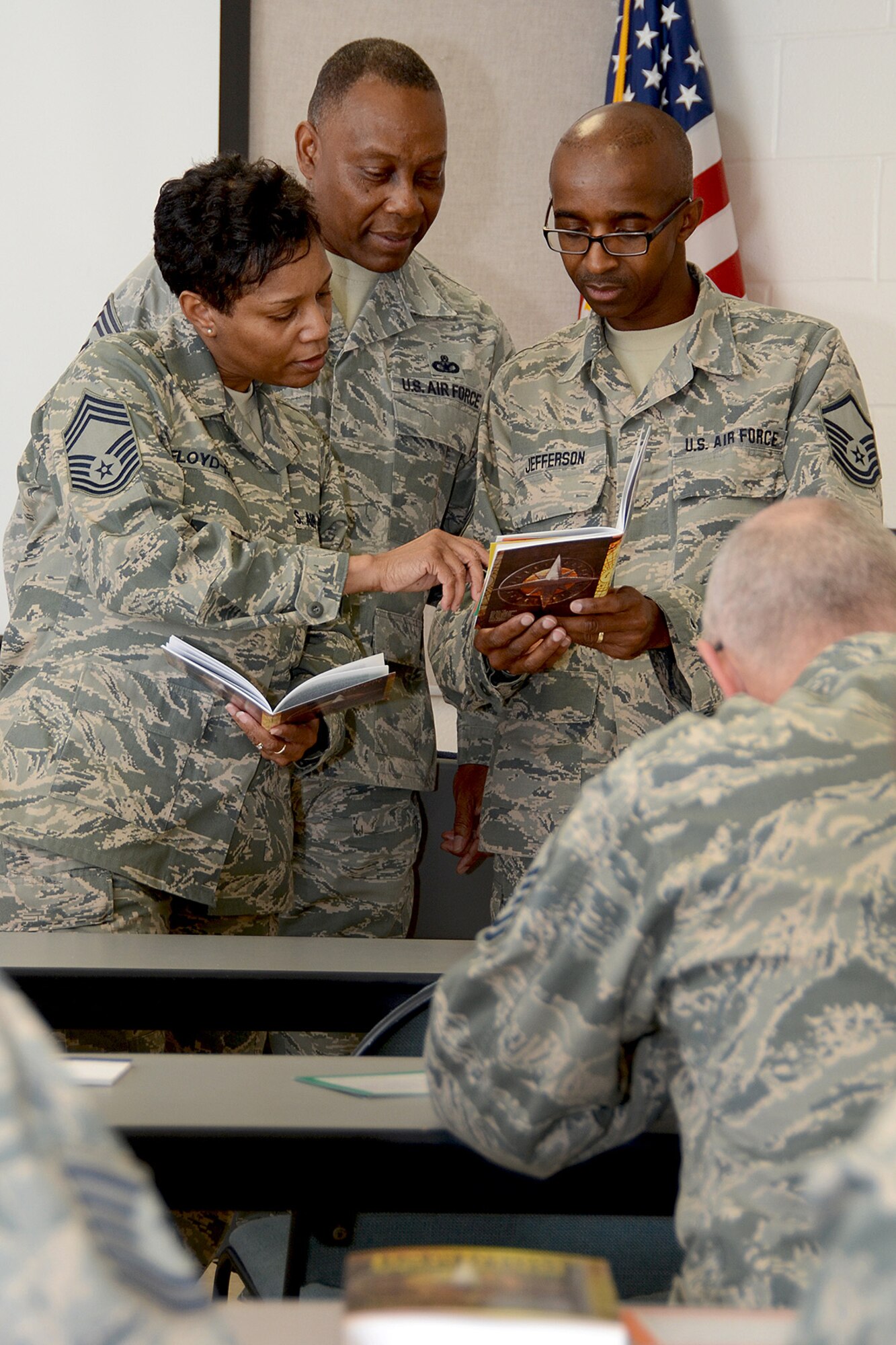 U.S. Air Force Airmen from the South Carolina Air National Guard receive Four Lenses training at McEntire Joint National Guard Base to learn how to better communicate with their coworkers, family and friends, Feb. 18, 2014. Leading the training are Chief Master Sgt. Bonita Floyd-Ross, 169th Fighter Wing Commander Chief Master Sgt. Robert Davis and Master Sgt. James Jefferson.  (U.S. Air National Guard photo by Senior Master Sgt. Edward Snyder/Released)