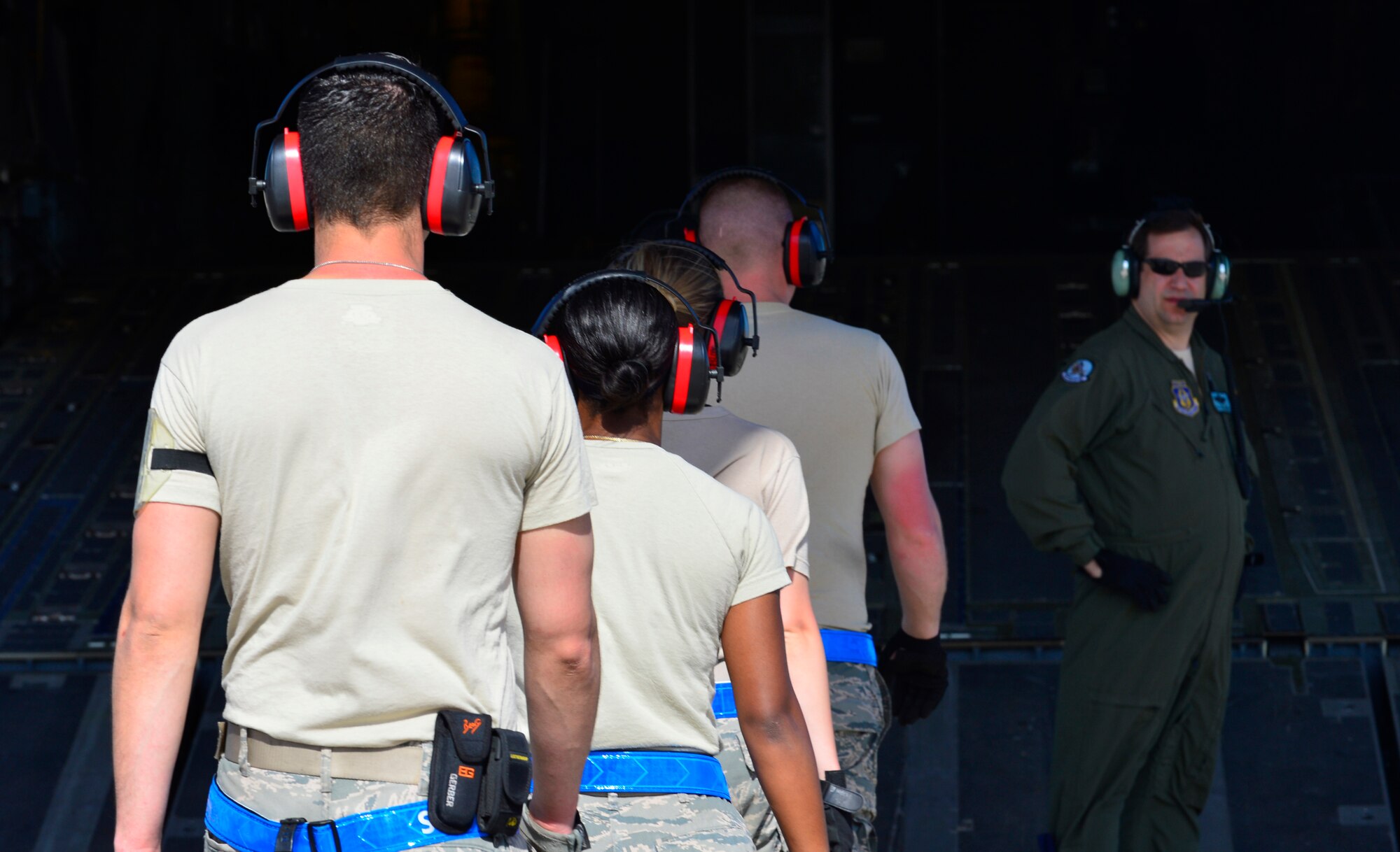 Airmen from the 46th Aerial Port Squadron board a C-17 Globemaster III during Operation Patriot Sands, Feb. 22, 2014 at Homestead Air Reserve Base, Fla. The Airmen were responsible for ensuring cargo and load plans were correctly configured for shipment. (U.S. Air Force photo/Staff Sgt. Elizabeth Morris)