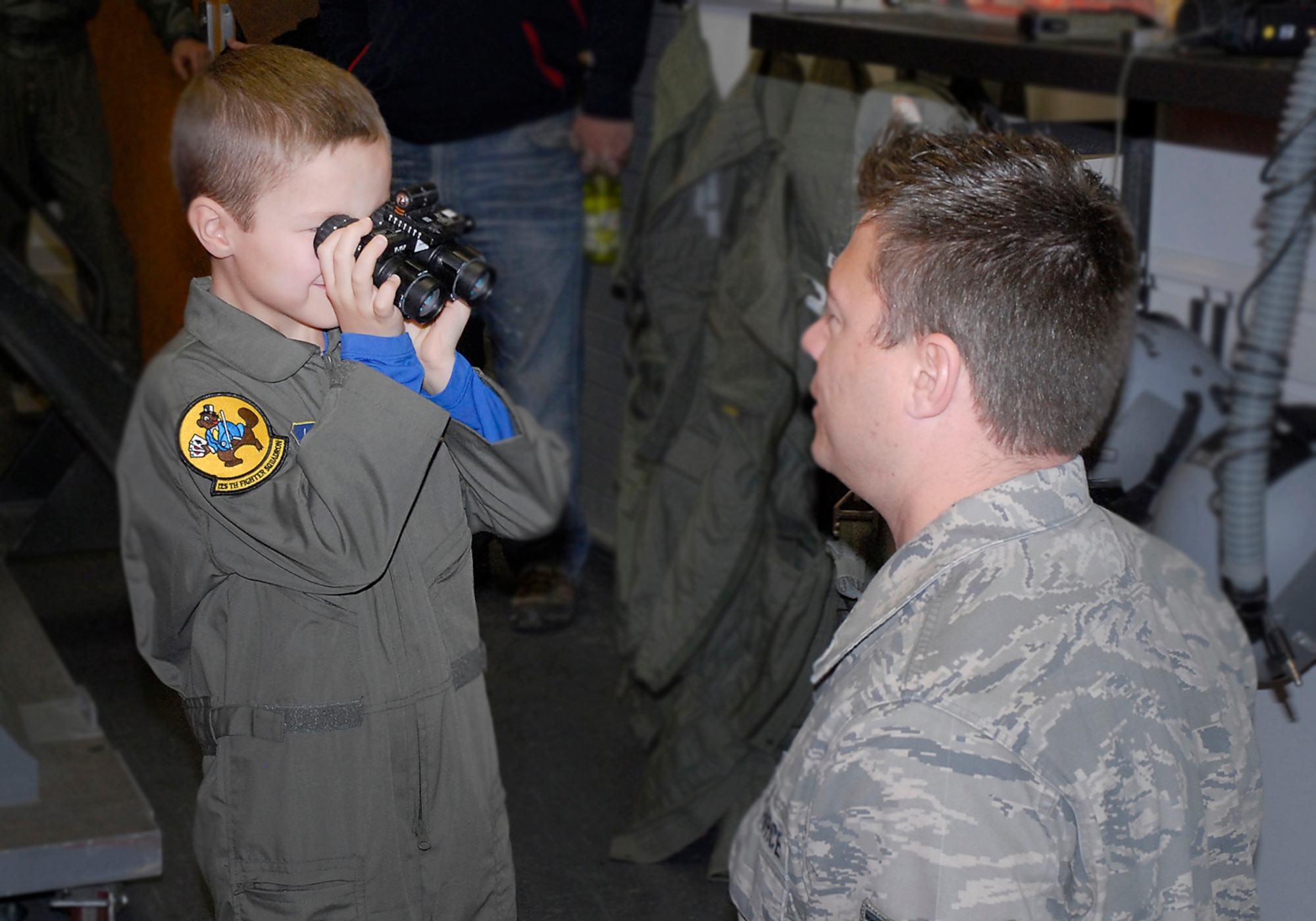 Zip "Flash" Gordon receives a life support briefing and looks through night vision goggles while being a "Pilot for a Day", 19 February 2014,  at the 138th Fighter Wing, Oklahoma Air National Guard, Tulsa, Okla.   (U.S. National Guard photo by Senior Airman Jasmine Stone/Released)