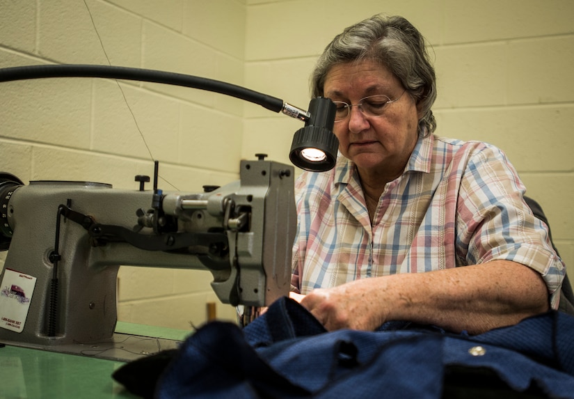 Linda Lewis, 437th Aircrew Flight Equipment fabrication shop, uses a sewing machine to fabricate a seat cover used on a C-17 Globemaster III Feb. 20, 2014, at Joint Base Charleston – Air Base, S.C. Lewis and nine other civilians work in the fabrication shop which saves the Air Force more than one million dollars every year by fabricating all fabric-related material used on JB Charleston’s C-17s.  (U.S. Air Force photo/ Senior Airman Dennis Sloan)