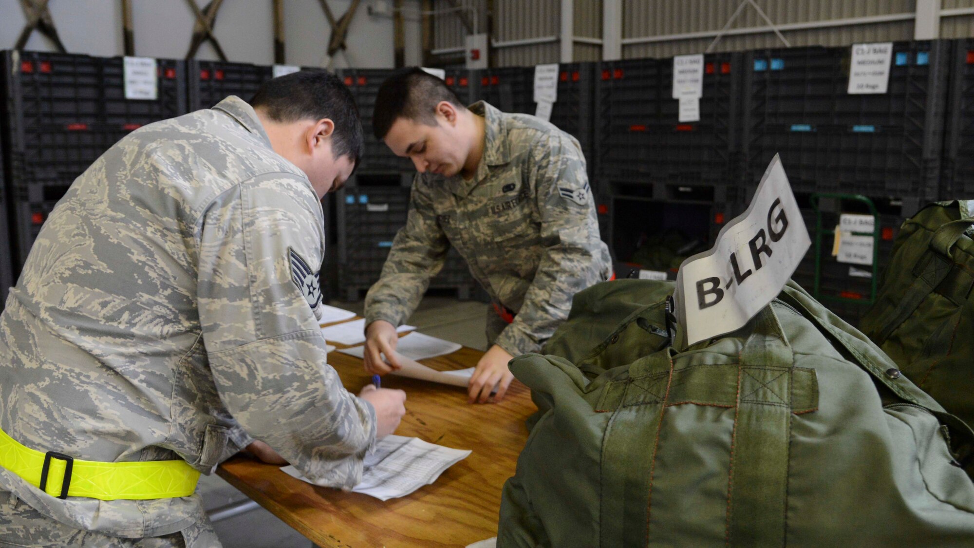 Staff Sgt. Joel Arnett, 374th Operation Support Squadron weather forecaster, checks out a type B deployment bag during the Samurai Readiness Inspection at Yokota Air Base, Japan, March 4, 2014.  The readiness inspection kicked off to ensure all Yokota Airmen are ready to assist real life contingency operations in the Pacific theater.  (U.S. Air Force photo by Airman 1st Class Soo C. Kim / released)
