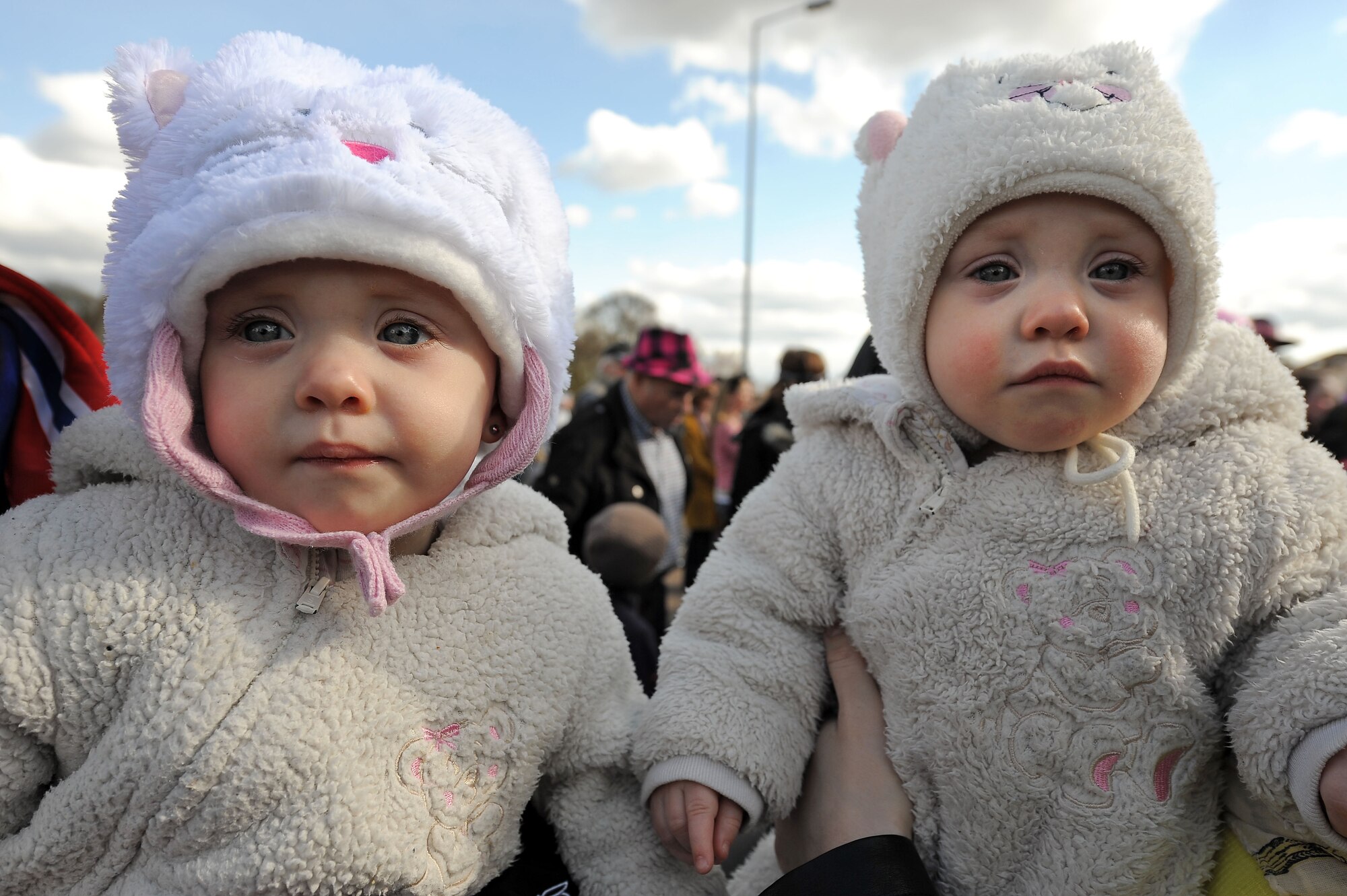 Children watch parade participants during the Fasching parade March 4, 2014, Ramstein Village, Germany. This annual event is a pre-Lenten carnival, which is celebrated with the donning of wild and fancy costumes to chase away the evil spirits of winter in preparation for spring. (U.S. Air Force photo/ Sara Pavich)