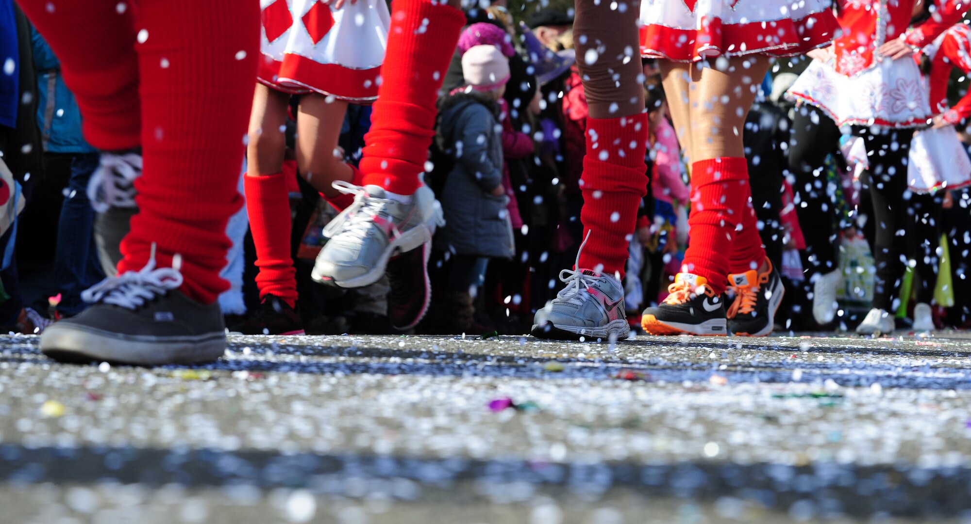 Members of the Fasching parade pass as the crowd throws confetti March 4, 2014, Ramstein Village, Germany. This annual event is a pre-Lenten carnival, which is celebrated with the donning of wild and fancy costumes to chase away the evil spirits of winter in preparation for spring. (U.S. Air Force photo/Senior Airman Hailey Haux)