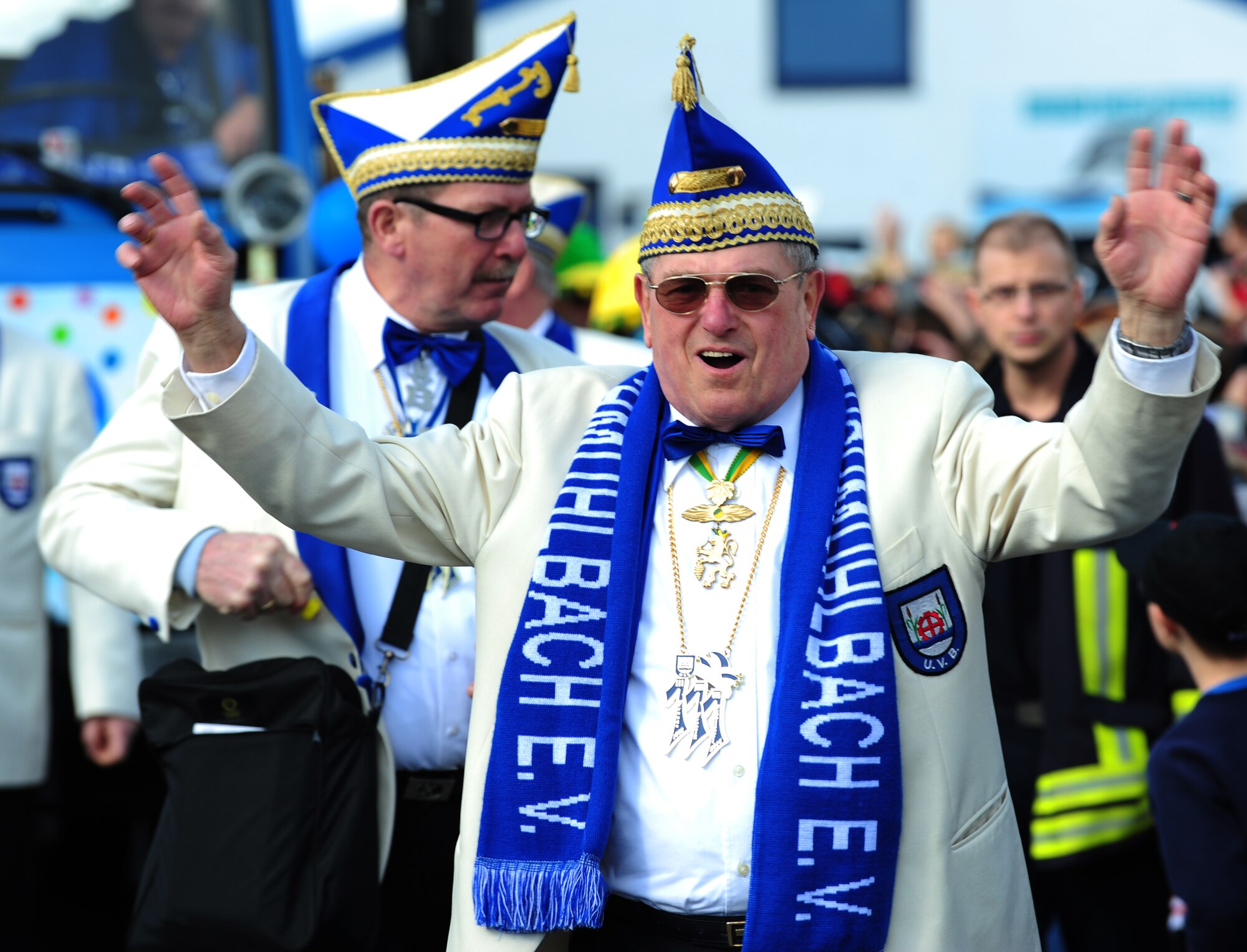 A Fasching parade member waves to the crowd March 4, 2014, Ramstein Village, Germany. This annual event is a pre-Lenten carnival, which is celebrated with the donning of wild and fancy costumes to chase away the evil spirits of winter in preparation for spring. (U.S. Air Force photo/Senior Airman Hailey Haux)