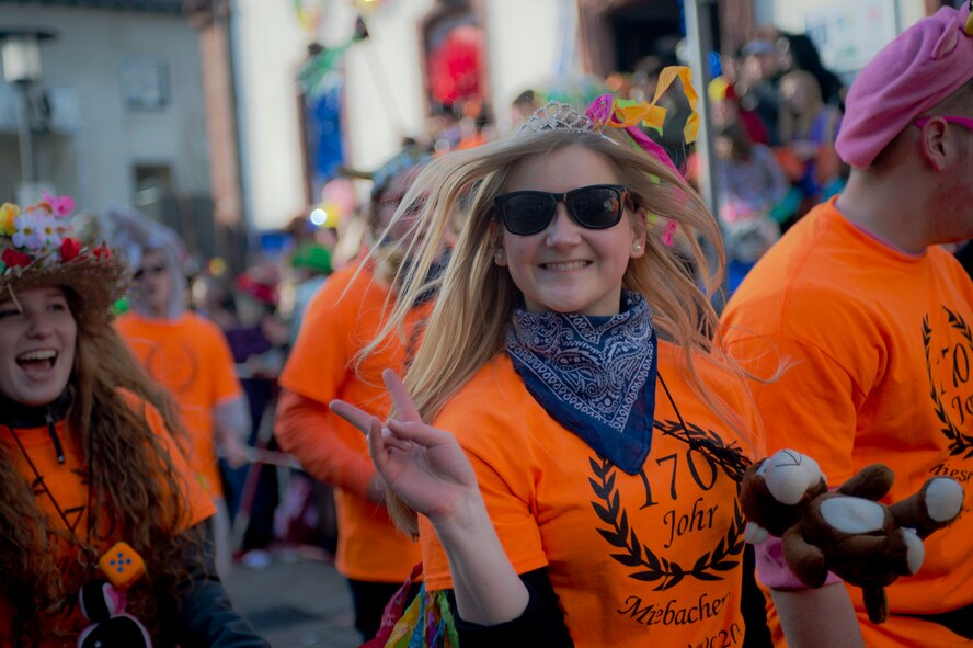 A Fasching parade reveler skips through the streets during an annual Fasching parade, March 4, 2014, Ramstein Village, Germany. This annual event is a pre-Lenten carnival, which is celebrated with the donning of wild and fancy costumes to chase away the evil spirits of winter in preparation for spring. (U.S. Air Force photo/Airman 1st Class Jordan Castelan)