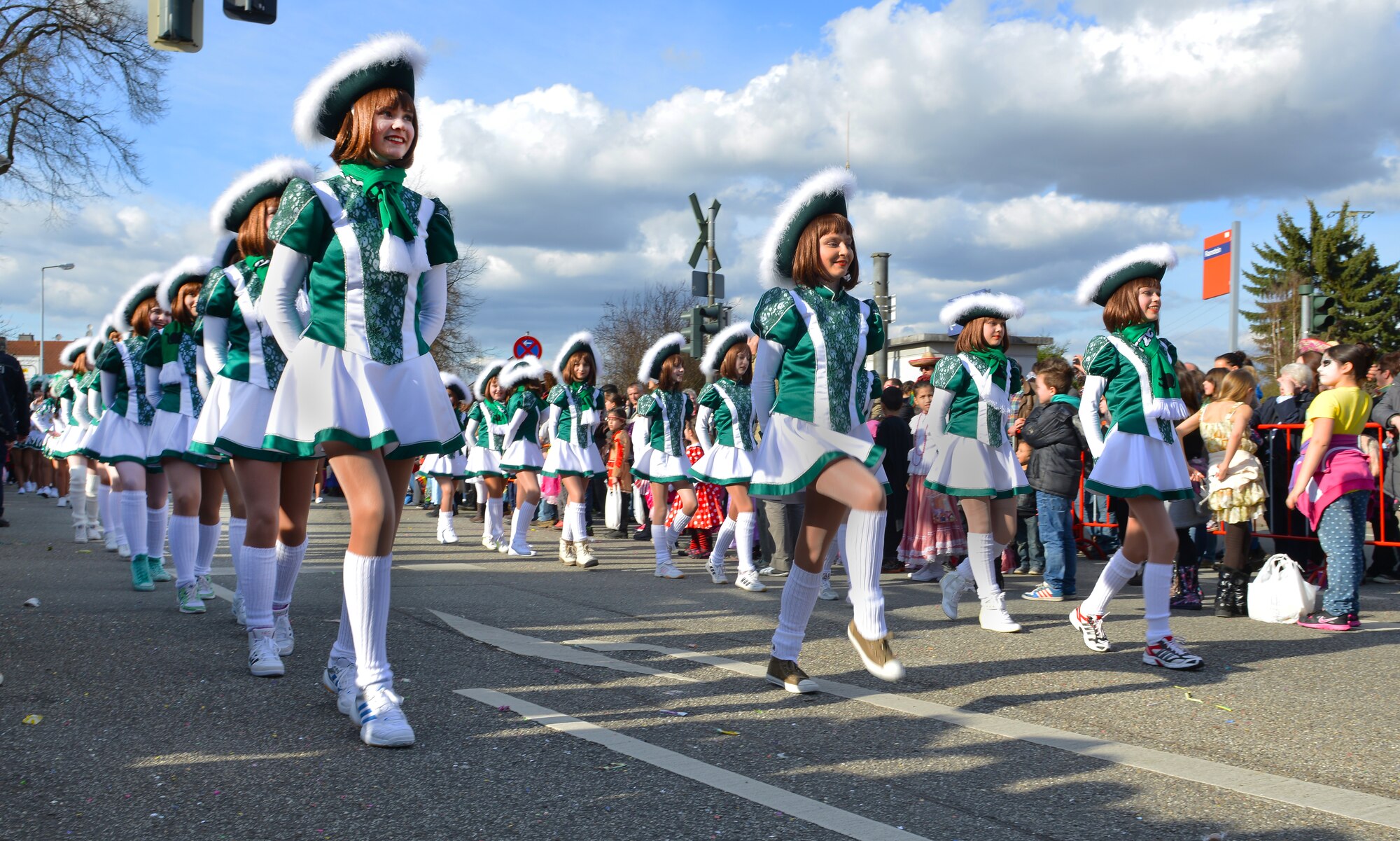 A dance team preforms during the Fasching parade March 4, 2014, Ramstein Village, Germany. This annual event is a pre-Lenten carnival, which is celebrated with the donning of wild and fancy costumes to chase away the evil spirits of winter in preparation for spring. (U.S. Air Force photo/Airman Dymekre Allen)