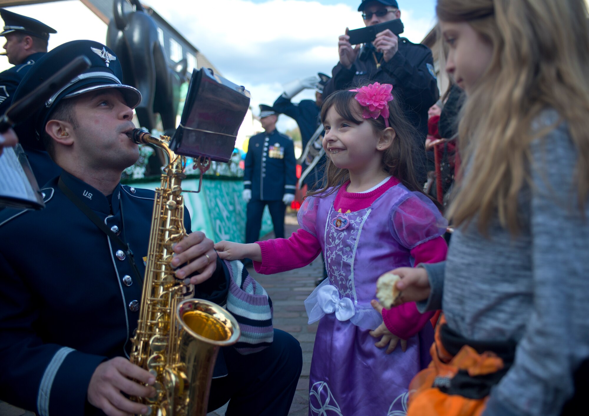 Staff Sgt. Lencys Nunez-Esteban, USAFE band member, plays a saxophone during an annual Fasching parade, March 4, 2014, Ramstein Village, Germany. This annual event is a pre-Lenten carnival, which is celebrated with the donning of wild and fancy costumes to chase away the evil spirits of winter in preparation for spring. (U.S. Air Force photo/Airman 1st Class Jordan Castelan)