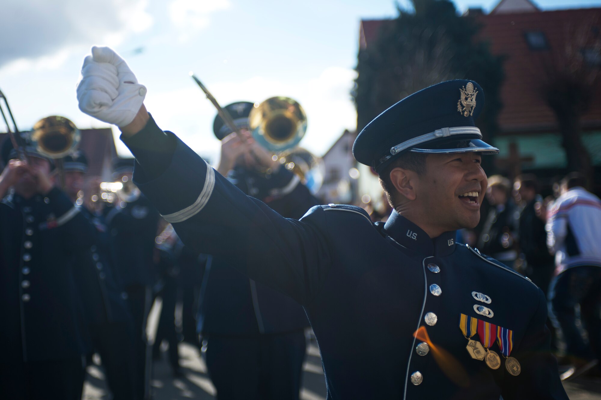 1st Lt. Thomas Gamboa, USAFE Band flight commander,
helps lead the band through the Fasching parade, March 4, 2014, Ramstein
Village, Germany. This annual event is a pre-Lenten carnival, which is
celebrated with the donning of wild and fancy costumes to chase away the
evil spirits of winter in preparation for spring. (U.S. Air Force
photo/Airman 1st Class Jordan Castelan
