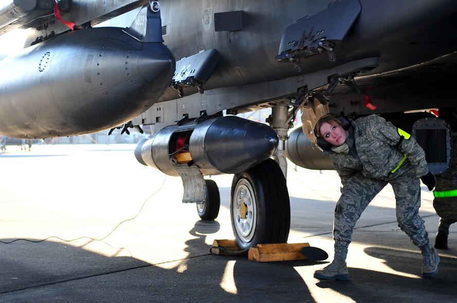 Senior Airman Cally Hatrick, 4th Aircraft Maintenance Squadron weapons load crew member, conducts a final inspection on an F-15E Strike Eagle prior to takeoff, Feb. 28, 2014, at Seymour Johnson Air Force Base, N.C. Airmen from the 4th Fighter Wing, left to participate in Red Flag 14-2 at Nellis Air Force Base, Nev. Red Flag is a realistic combat training exercise that incorporates all spectrums of warfare including command and control, real-time intelligence, analysis and exploitation, and electronic warfare. (U.S. Air Force photo/Airman 1st Class Shawna L. Keyes)    