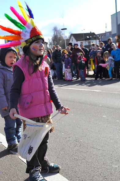 Children run to the street to grab candy thrown by parade participants March 4, 2014, Ramstein Village, Germany. This annual event is a pre-Lenten carnival, which is celebrated with the donning of wild and fancy costumes to chase away the evil spirits of winter in preparation for spring.  (U.S. Air Force photo/Airman Larissa Greatwood)