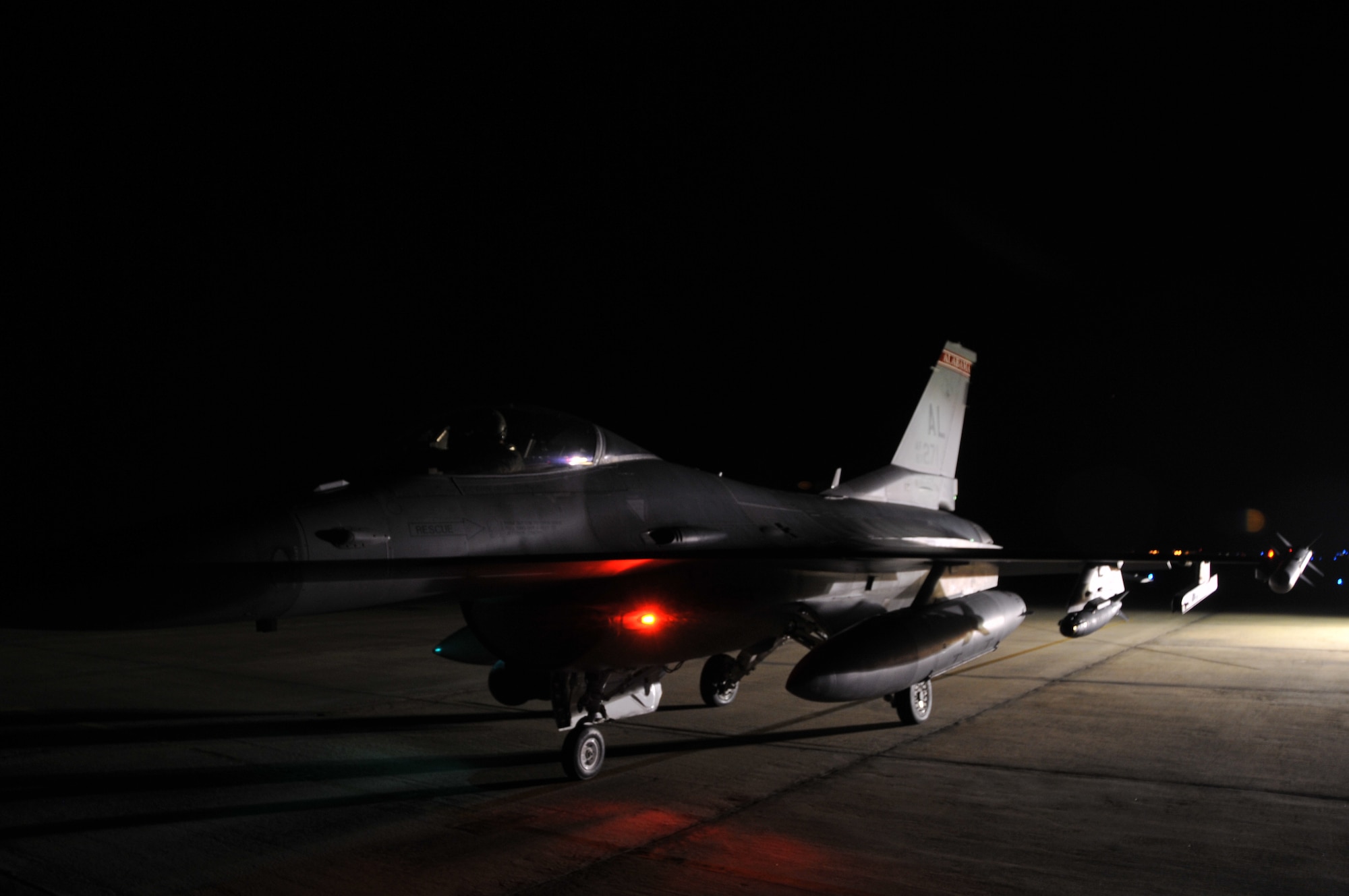 Alabama Air National Guard Capt. Scott Eshelman prepares for a night takeoff in an F-16 Fighting Falcon at Dannelly Field Air National Guard Base, Ala., Feb. 26, 2014. Night flying operations are used to train pilots on how to fly and fight in the dark. (U.S. Air Force photo by Tech. Sgt. Matthew Garrett)