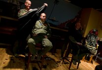 Air crew members from the 23rd Bomb Squadron shave the hair off their heads at Minot Air Force Base, N.D., Feb. 21, 2014. The crew members shaved their heads to support a 5-year-old cancer patient. (U.S. Air Force photo/Senior Airman Brittany Y. Auld)