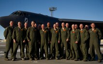 Members of the 23rd Bomb Squadron pose for a group photo with clean-shaven heads for Brayden Mitchell, who has diagnosed with a stage three Wilms tumor, a form of kidney cancer. Capt. Michael DeVita, 23rd BS B-52 instructor pilot, is a friend of the Mitchell family. (U.S. Air Force photo/Senior Airman Brittany Y. Auld)