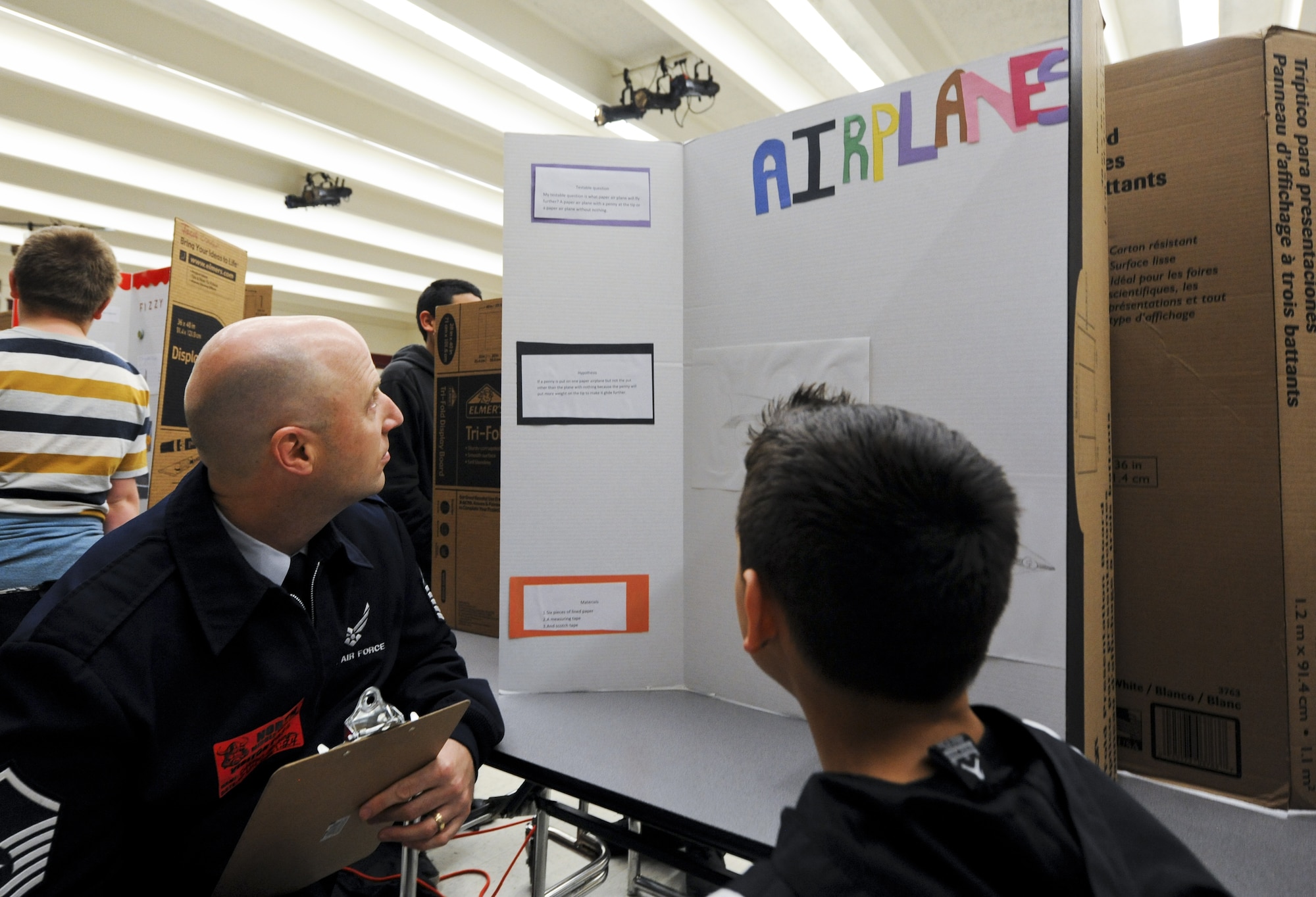 COLORADO SPRINGS, Colo. – Master Sgt. Steven Schobinger, Air Force Space Command, grades a science project Feb. 24 at North Middle School in Colorado Springs, Colo. Schobinger volunteered at the school as part of Peterson Air Force Base, Colo., service member’s efforts to be involved in the community. (U.S. Air Force photo/Staff Sgt. Jacob Morgan)