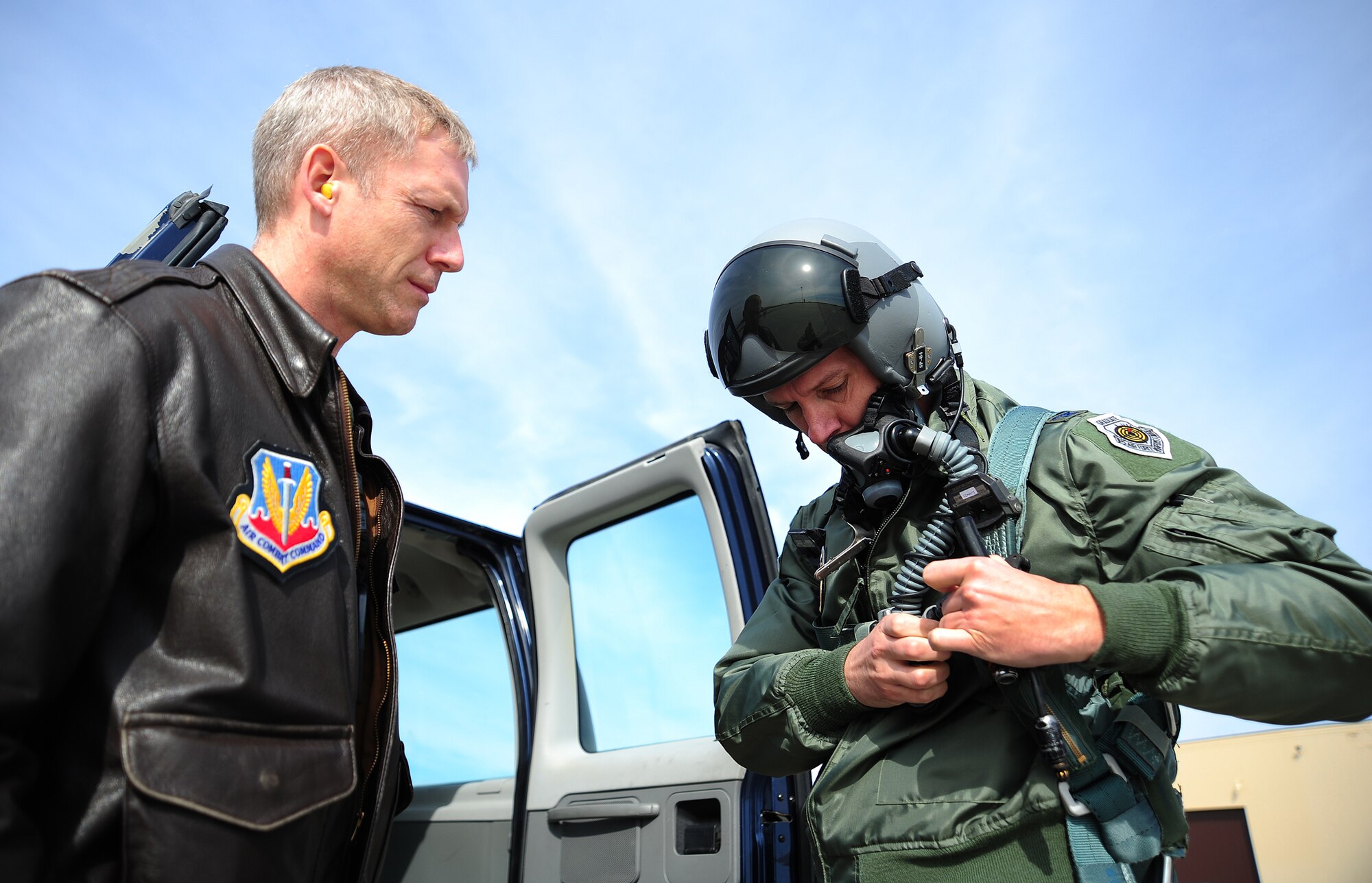 Lt. Col. Michael Wittrock, 72nd Test and Evaluation Squadron B-2 instructor pilot helps Col. Alexus Grynkewich, the 53rd Wing commander, prepare for his orientation flight in the B-2 Spirit at Whiteman Air Force Base, Mo., Feb. 24.  The 72nd TES is a geographically separated B-2 test squadron of the 53rd WG.  (U.S. Air Force photo/Staff Sgt. Nicholas Wilson)