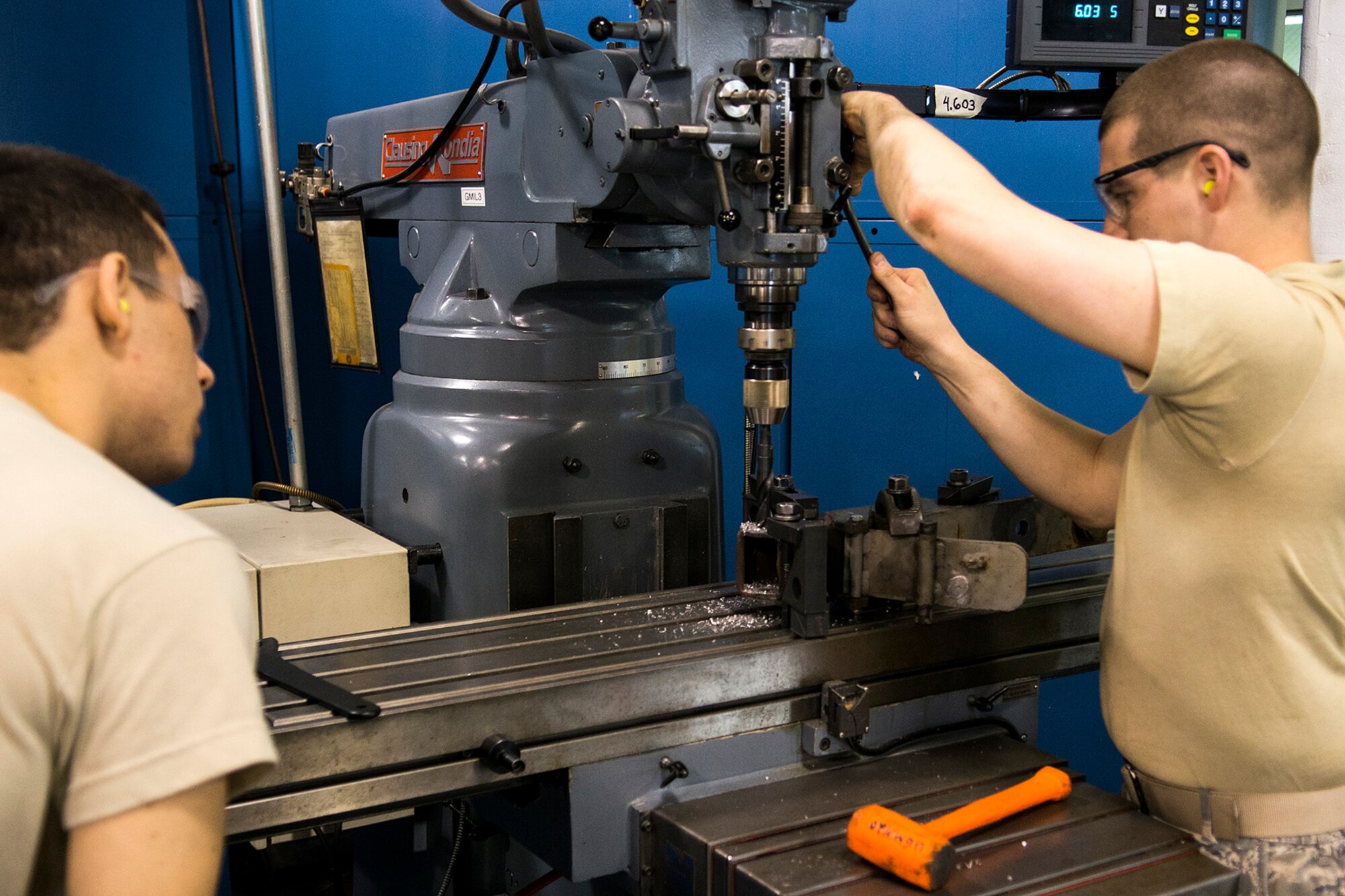U.S. Air Force Senior Airmen Matt Windmann (left) and Travis Reuther work together on a drilling project during the 307th Bomb Wing's March Unit Training Assembly, Mar. 2, 2014, Barksdale Air Force Base, La. Both Airmen are metal technicians assigned to the 307th Maintenance Squadron. (U.S. Air Force photo by Master Sgt. Greg Steele/Released)