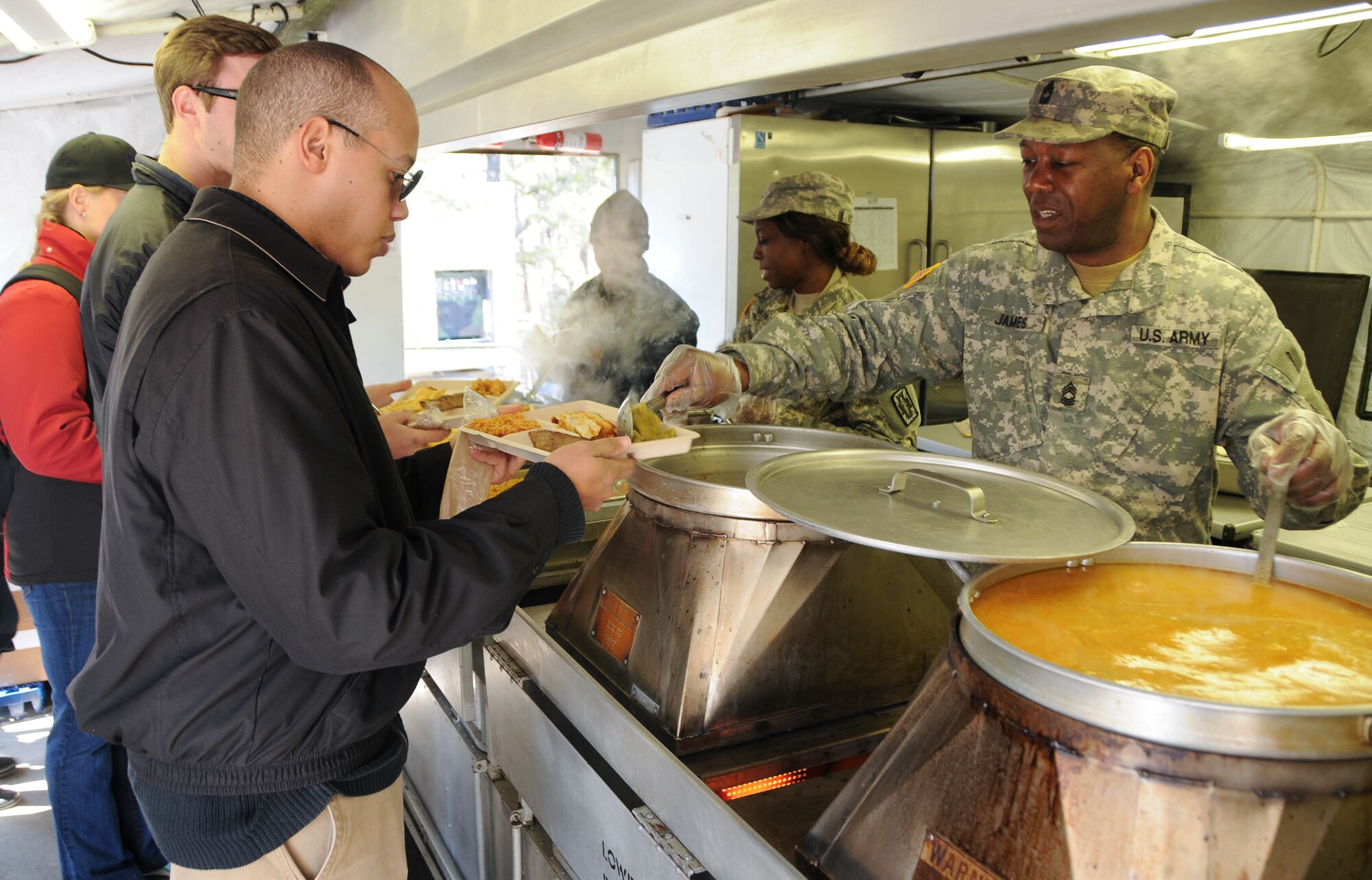 Congressional staff members break for lunch with Army ReservesSoldiers Feb. 24 during a tour of the joint Combat Support Training Exercise hosted by the Army Reserve's 78th Training Division at Joint Base McGuire-Dix-Lakehurst, N.J. The staff-delegation tour was designed to highlight the Army Reserve's capabilities as an operational force and the importance of maintaining these capabilities into the future. (U.S. Army photo by Staff Sgt. Shawn Morris/Released)