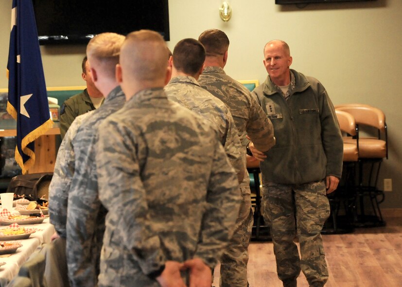 Lt. Gen. Stephen Wilson, Air Force Global Strike Command commander, shakes hands with several Malmstrom Air Force Base company grade officers at a lunch at the Aces High Bowling Alley on Feb. 26. Following the lunch, Wilson held an all call for Team Malmstrom members to address many different topics, including the newly implemented Force Improvement Program and possible changes under the New Strategic Arms Reduction Treaty. (U.S. Air Force photo/Senior Airman Cortney Paxton)