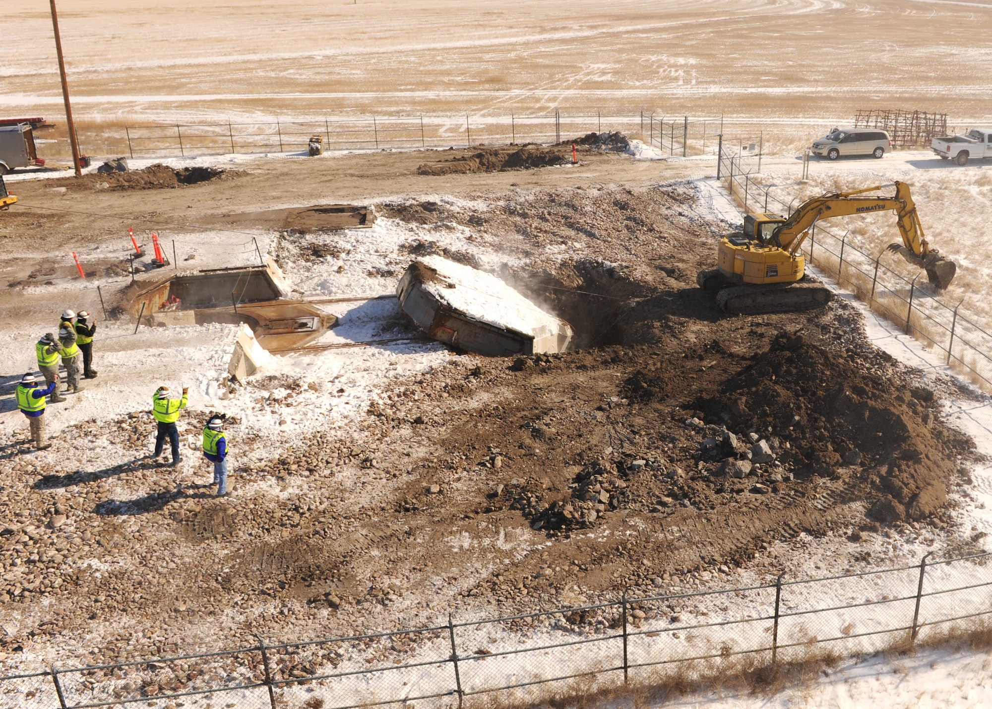 The launcher closure door is pulled from the top of Launch Facility R-29, Pondera County, Mont., Feb. 25. A nine-foot deep hole was dug for the 110-ton launcher closure door and the dirt from the hole was used to fill in the silo. The 50 Minuteman III intercontinental ballistic missile silos belonging to the 341st Missile Wing, Malmstrom Air Force Base, are being eliminated in accordance with the New Strategic Arms Reduction Treaty requirements.  The missile launch facilities set to be eliminated were part of the 564th Missile Squadron, which were deactivated in 2008. (U.S. Air Force photo/Senior Airman Katrina Heikkinen)