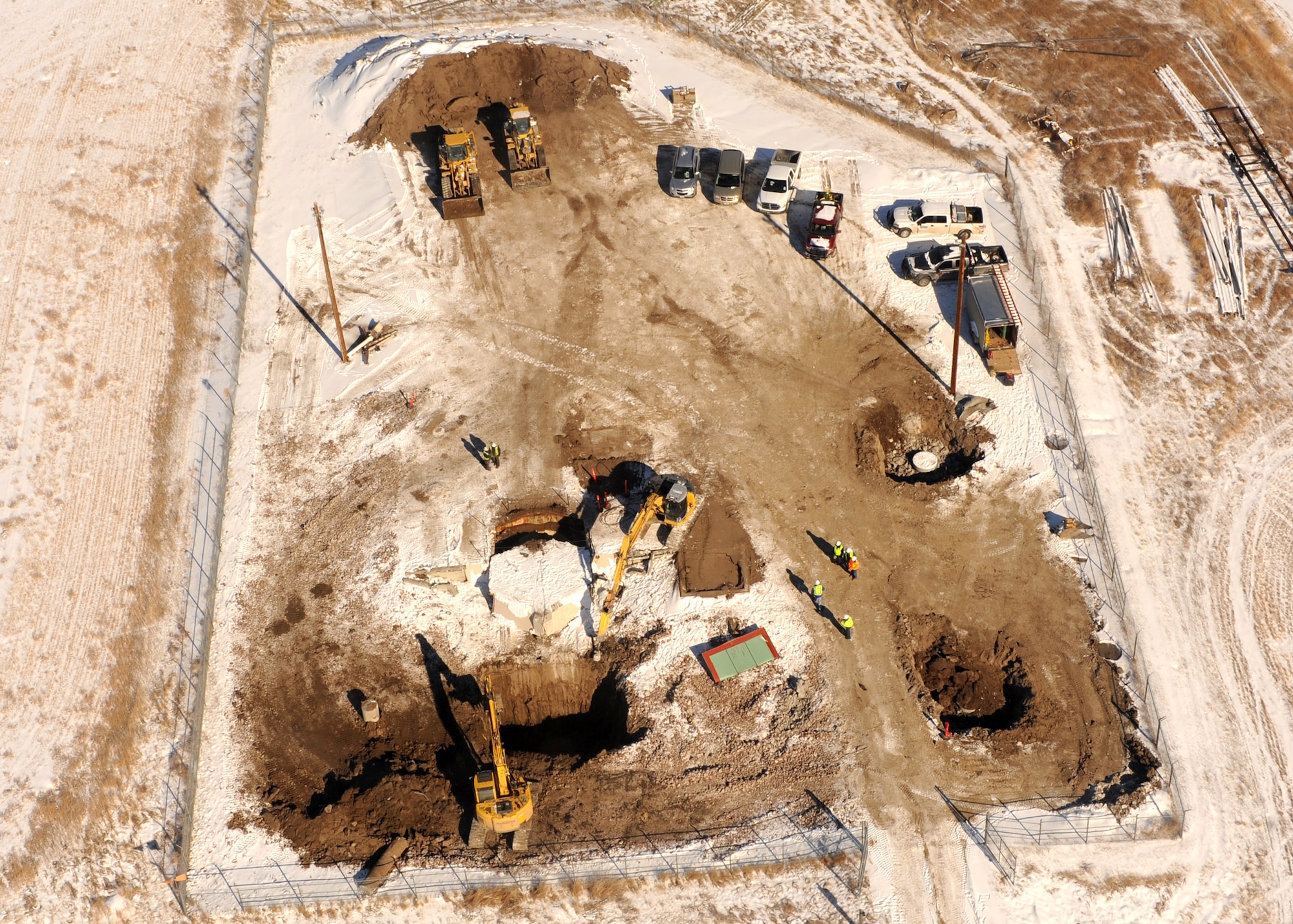 A bird’s eye view of Launch Facility R-29, Pondera County, Mont., shows construction workers preparing to pull a launcher closure door into a hole Feb. 25. The 50 Minuteman III intercontinental ballistic missile silos belonging to the 341st Missile Wing, Malmstrom Air Force Base, are being eliminated in accordance with the New Strategic Arms Reduction Treaty requirements.  The missile launch facilities being eliminated were part of the 564th Missile Squadron, which were deactivated in 2008. (U.S. Air Force photo/Senior Airman Katrina Heikkinen)
