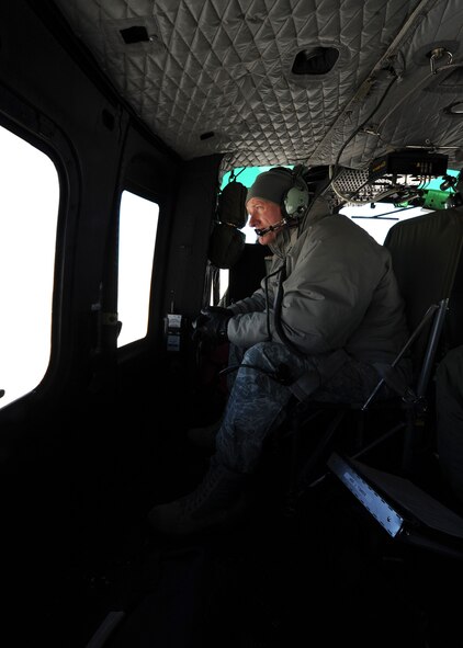 Col. Robert Stanley, 341st Missile Wing commander, looks out the window of a UH-1N Huey helicopter Feb. 25. Stanley and Chief Master Sgt. Phillip Easton, 341st MW command chief, make frequent visits to the missile complex to witness the permanent elimination of 50 previously deactivated 564th Missile Squadron Minuteman III launch facilities. (U.S. Air Force photo/Senior Airman Katrina Heikkinen)  