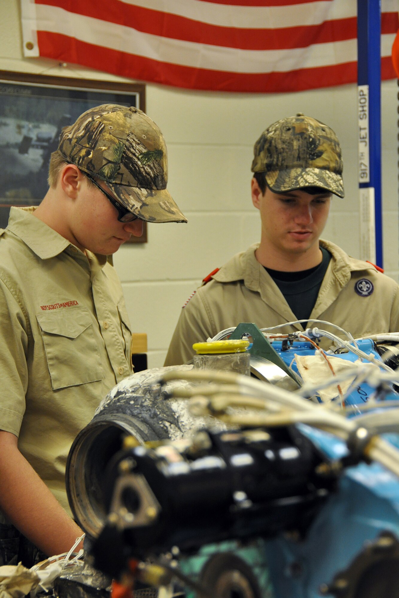 Boy scouts with Troop 531 out of Angleton, Texas, study an engine at the 307th Bomb Wing Engine Shop March 1, 2014. The Troop visited Barksdale Air Force Base, La., for an orientation tour including visits to the munitions storage area, life support, B-52 static display and Global Power Museum.  (U.S. Air Force photo by Master Sgt. Mary Hinson/Released)