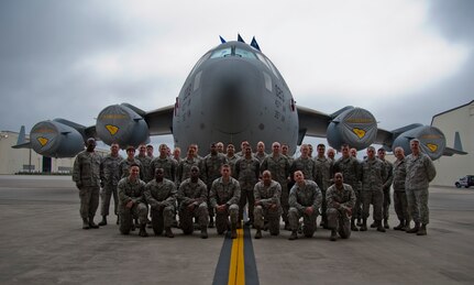 Col. Dennis Dabney, 437th Maintenance Group commander Col. Richard Gay, 315th Maintenance Group commander, congratulate Joint Base Charleston’s newest dedicated crew chiefs Feb. 21, 2014, following a Dedicated Crew Chief ceremony at Joint Base Charleston – Air Base, S.C.. The 31 maintainers were selected as dedicated crew chiefs and assigned their own aircraft. Every Charleston C-17 Globemaster III now has a dedicated crew chief and assistant crew chief. (Air Force photo/Staff Sgt. William O’Brien)