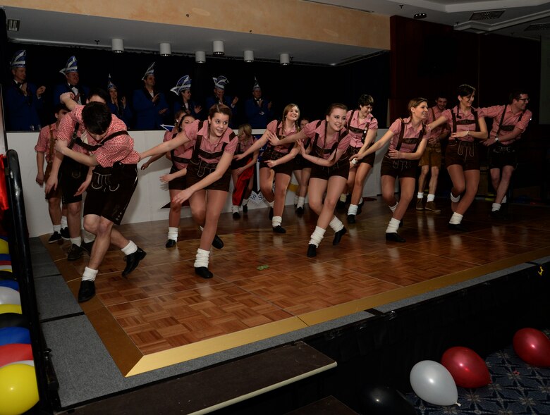 A troupe of dancers from the Eifel community perform during the inaugural Saber Kappensitzung at Club Eifel on Spangdahlem Air Base, Germany, Feb. 28, 2014. More than 10 groups from the Eifel region performed musical and dance routines at the event. (U.S. Air Force photo by Staff Sgt. Joe W. McFadden/Released)
